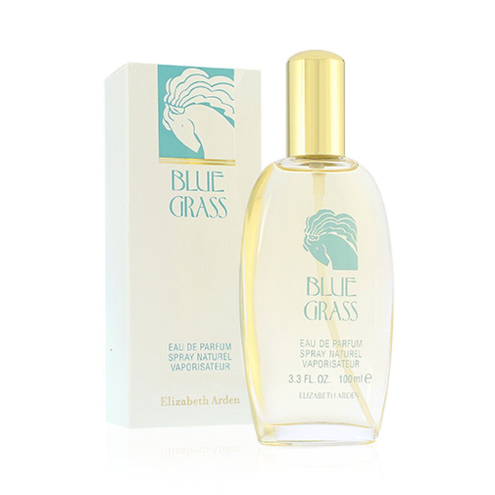 Glazen fles en doos. Fles met gouden dop, opschrift "BLUE GRASS". Tekst: Eau de Parfum, Spray Naturel, Vaporisateur. Merk: Elizabeth Arden.