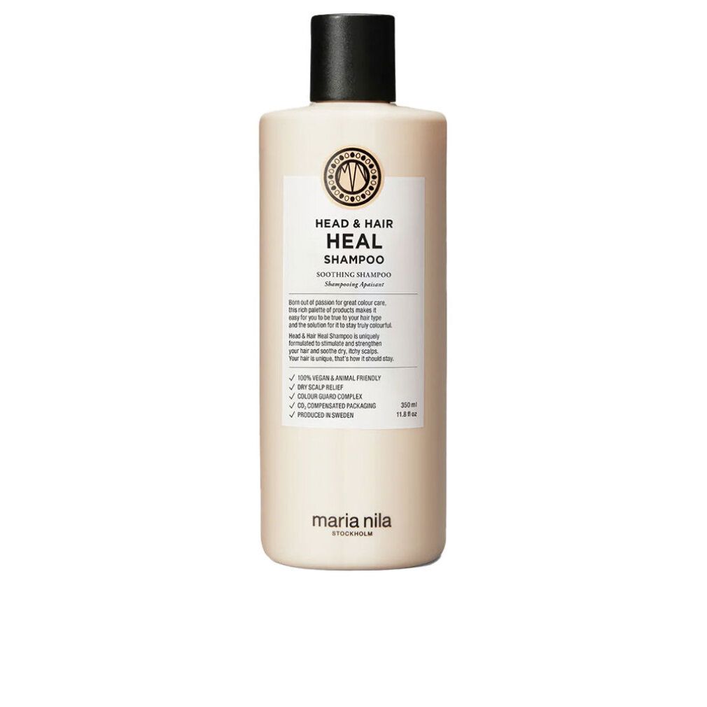 Maria Nila Head & Hair Heal Shampoo. Beige fles met zwarte dop. Etiket met productinfo en logo. Vegan en dierproefvrij.