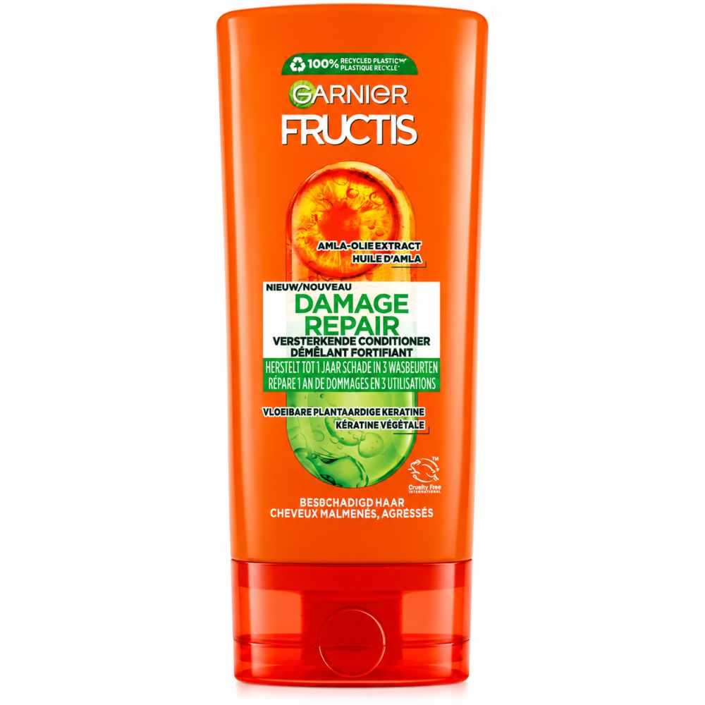 Oranje tube Garnier Fructis Damage Repair met Amla-olie extract en plantaardige keratine formule.