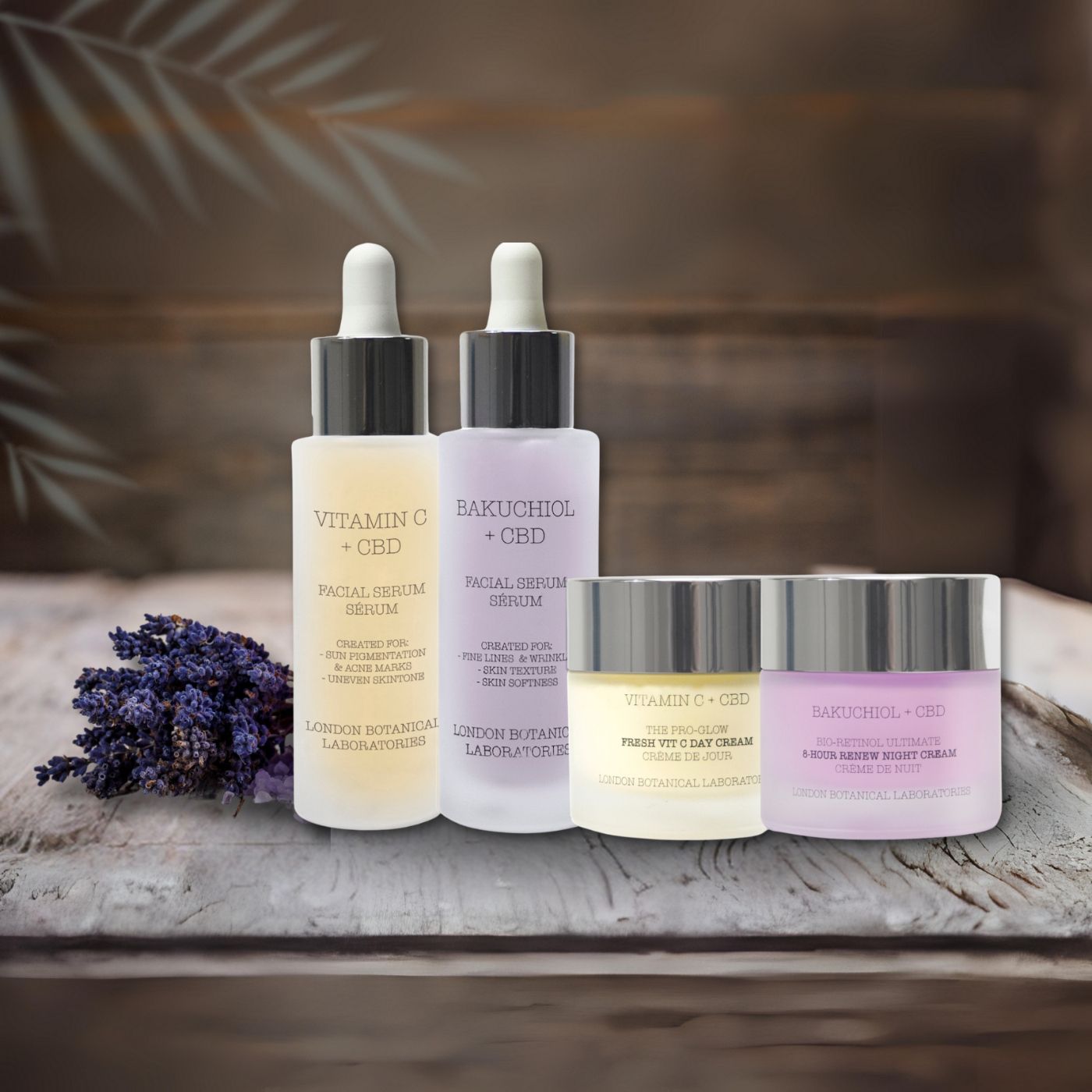 Ensemble de soins du visage avec deux sérums et deux crèmes. Inscriptions : Vitamine C + CBD, Bakuchiol + CBD, crème jour et nuit. Lavande.