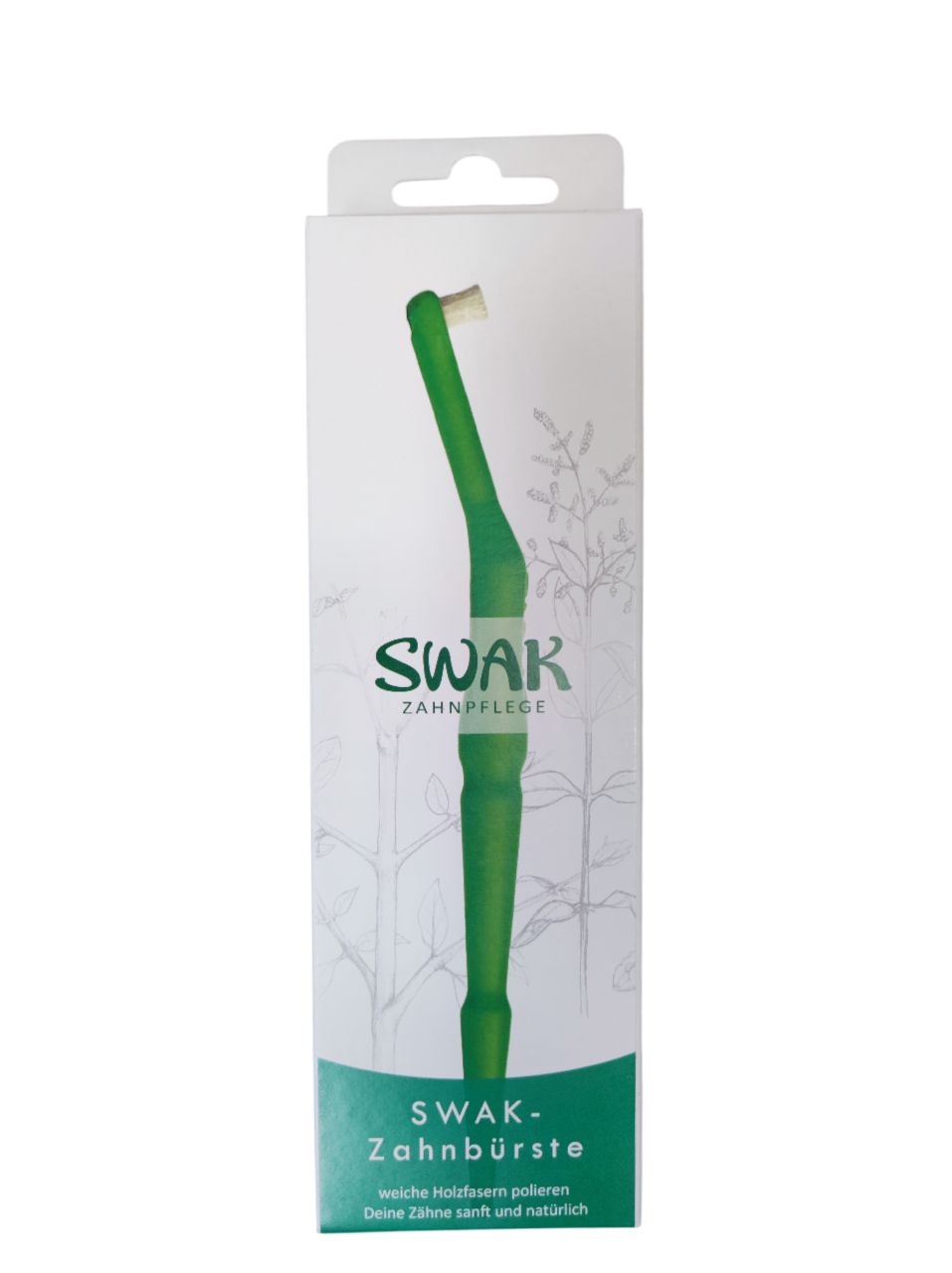 Brosse à dents dans un emballage blanc. Inscription: SWAK-Zahnpflege.