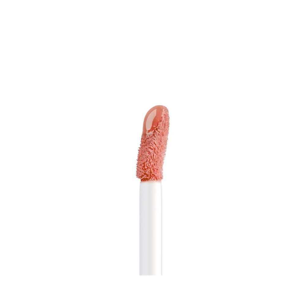 Applicator met Artdeco Plumping Lip Fluid. De applicator heeft een roze kleur.