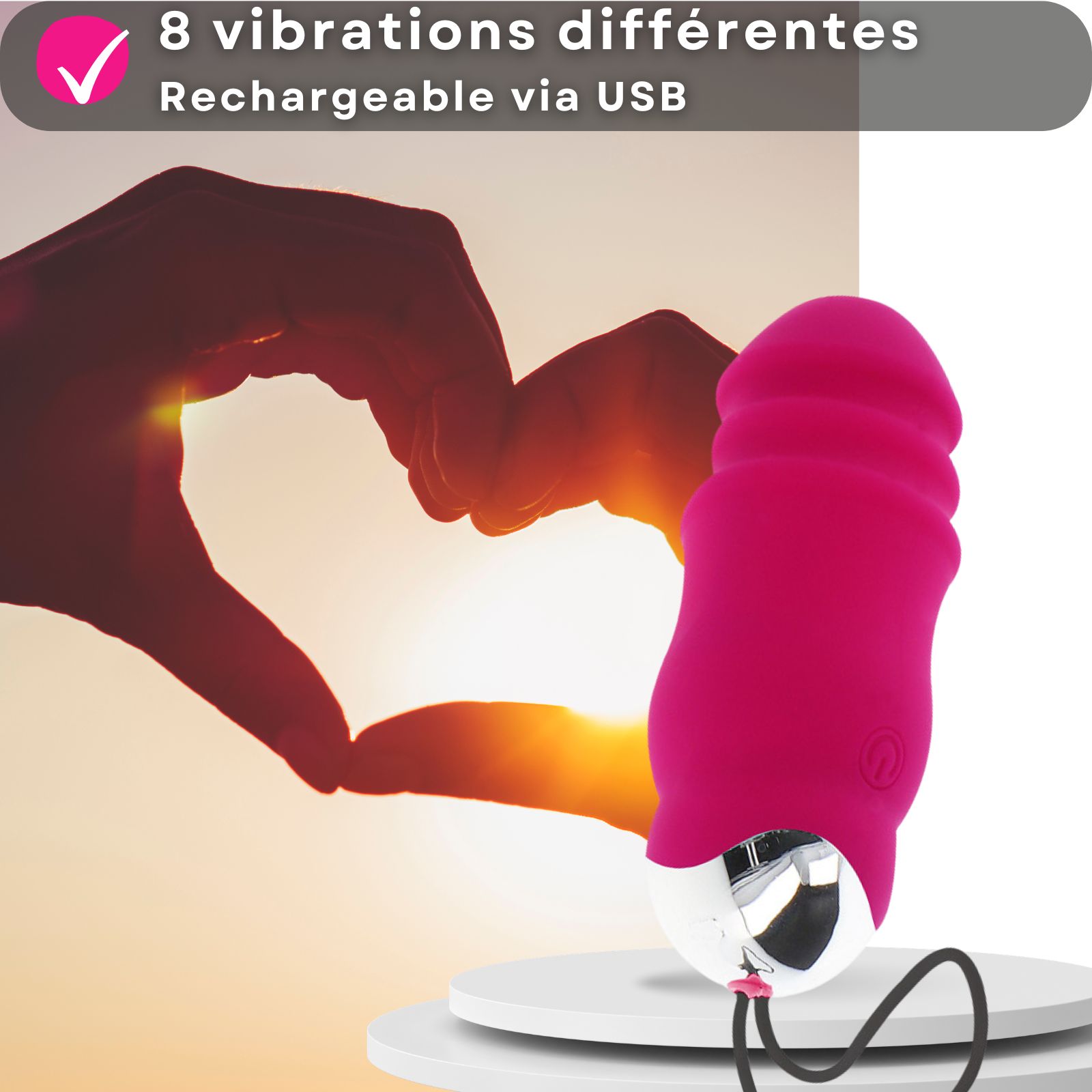 Oeuf vibrant rose. 8 modes de vibration. Rechargeable USB. Sur socle. Mains en cœur.