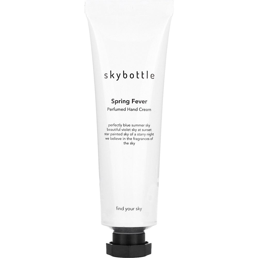 Tube blanche avec bouchon noir. Inscription: skybottle, Spring Fever, Perfumed Hand Cream. Texte en dessous.