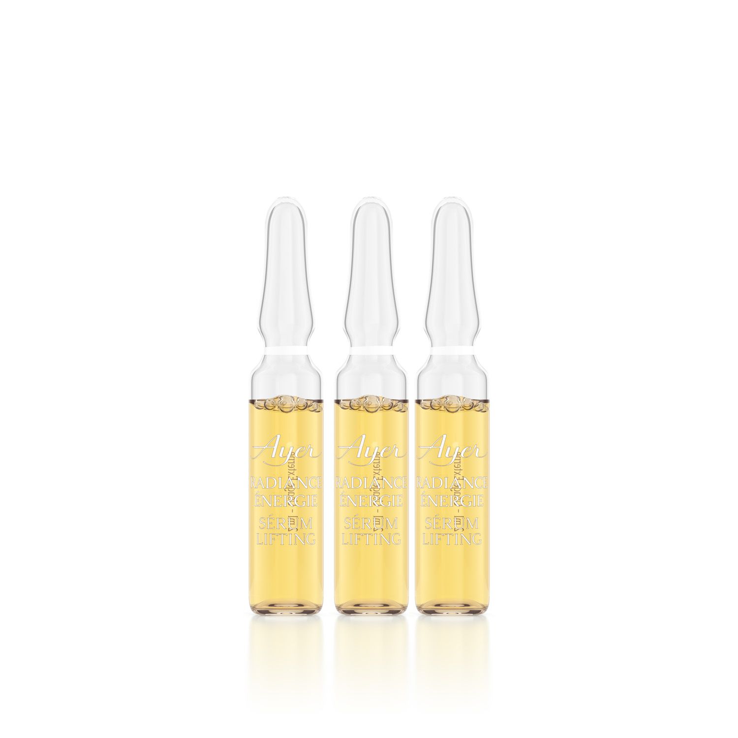 Trois ampoules en verre avec liquide jaunâtre. Inscription Ayer Radiance Energy Lifting Serum.