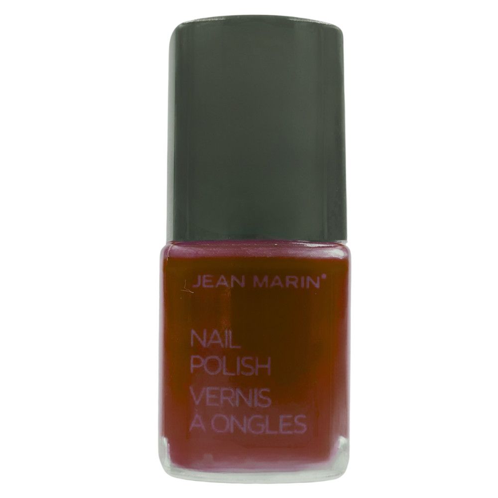 Flacon de vernis à ongles Jean Marin. Liquide rouge dans un flacon en verre transparent avec bouchon noir. Nom du produit.