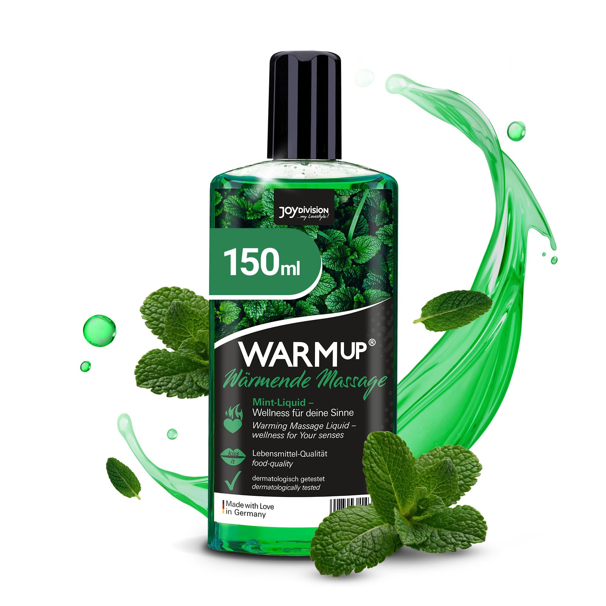 Fles muntmassageolie, omringd door muntbladeren en groene spetters.