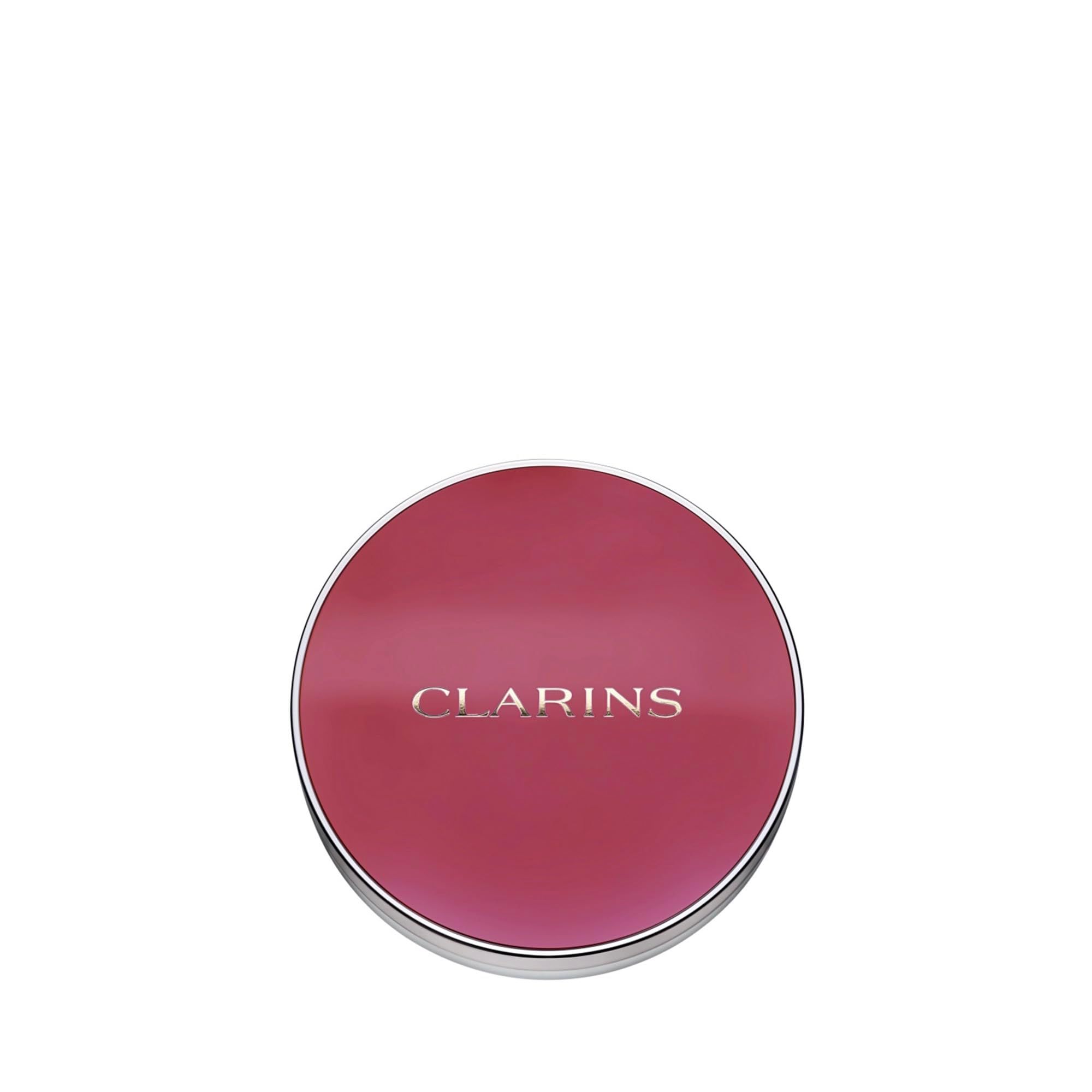 Boîtier de blush rond avec bord argenté. Couvercle avec nom de marque, couleur prune.