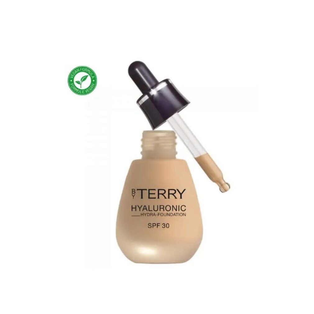 Beige fles met pipet. Opschrift: BY TERRY, Hyaluronic Hydra-Foundation, SPF 30. Vegan-label.