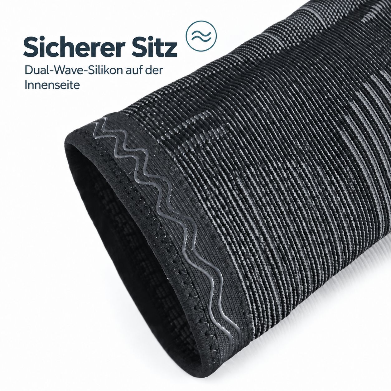 Gedetailleerd zicht kniebandage: binnenzijde met Dual-Wave siliconen strips voor stevige grip. Gebreid materiaal met ribbels.