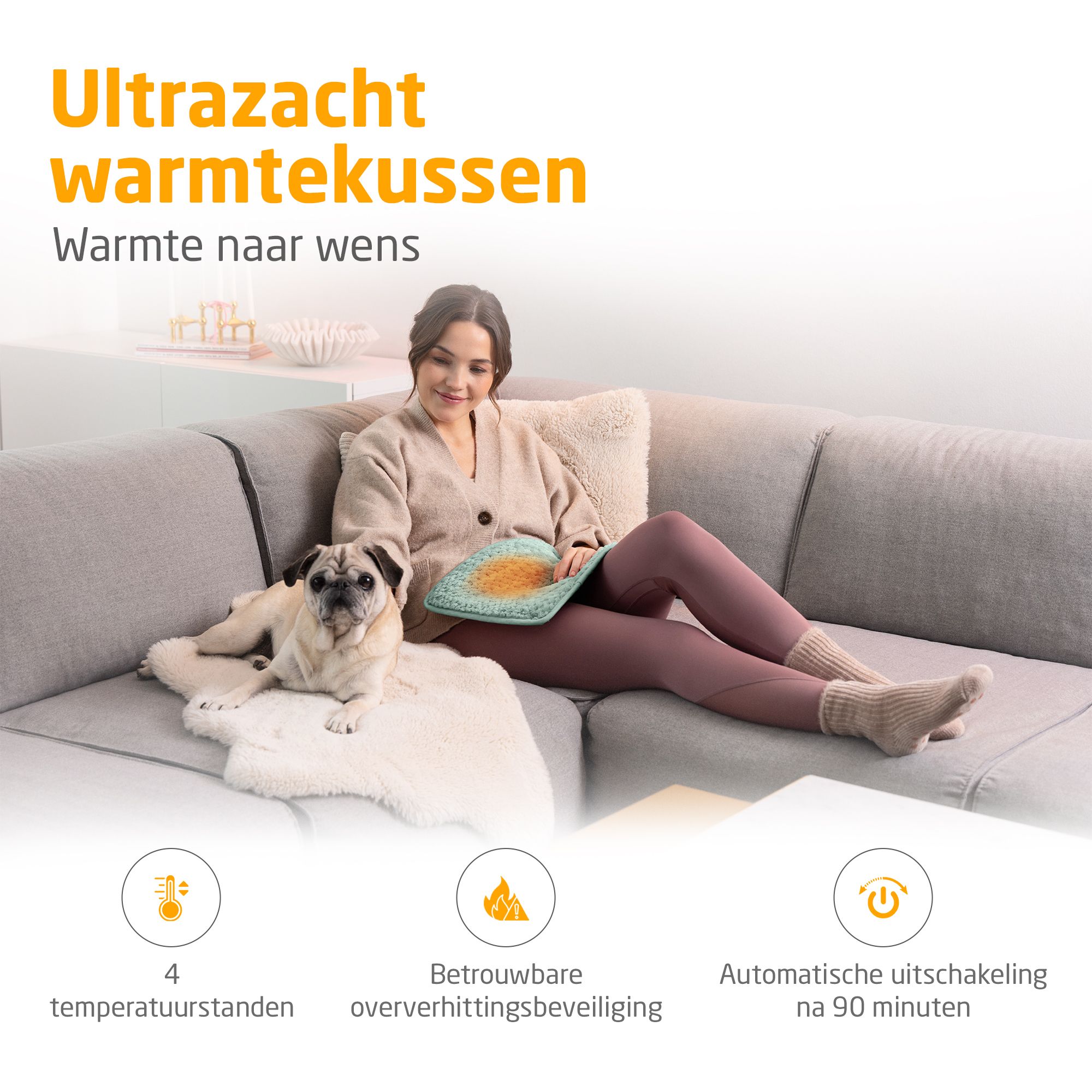 Groen warmtekussen. Vrouw op bank met hond. 4 temp. standen, oververhittingsbeveiliging, automatische uitschakeling.