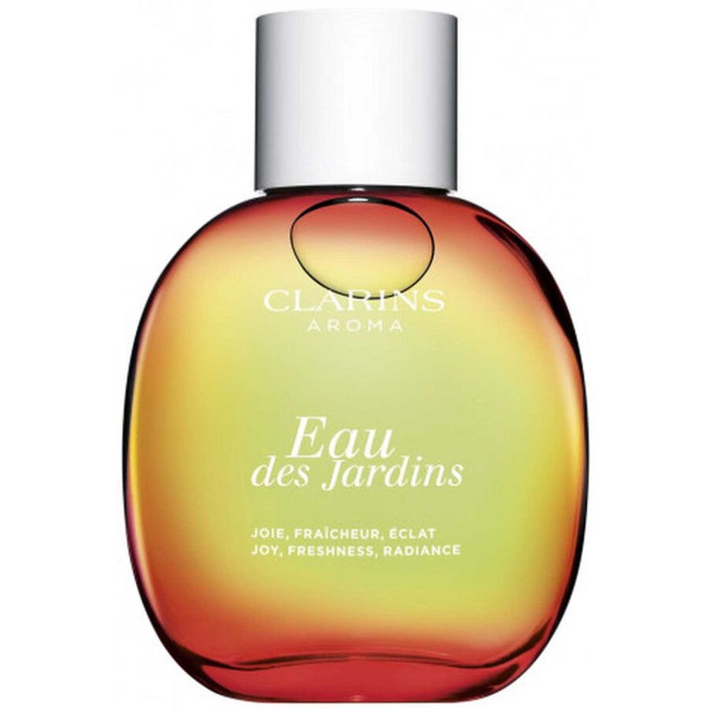 Ronde fles met witte dop. Opschrift: Eau des Jardins, Clarins Aroma. Gele tot rode kleurverloop.