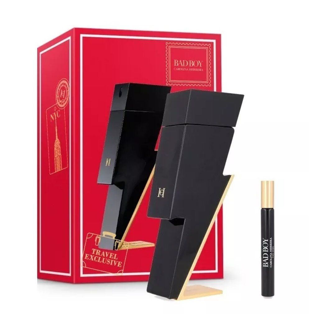 Zwart bliksemvormig parfumflesje met gouden voet, naast een kleiner rollerball-flesje en een rode geschenkdoos met "Bad Boy"-opschrift.