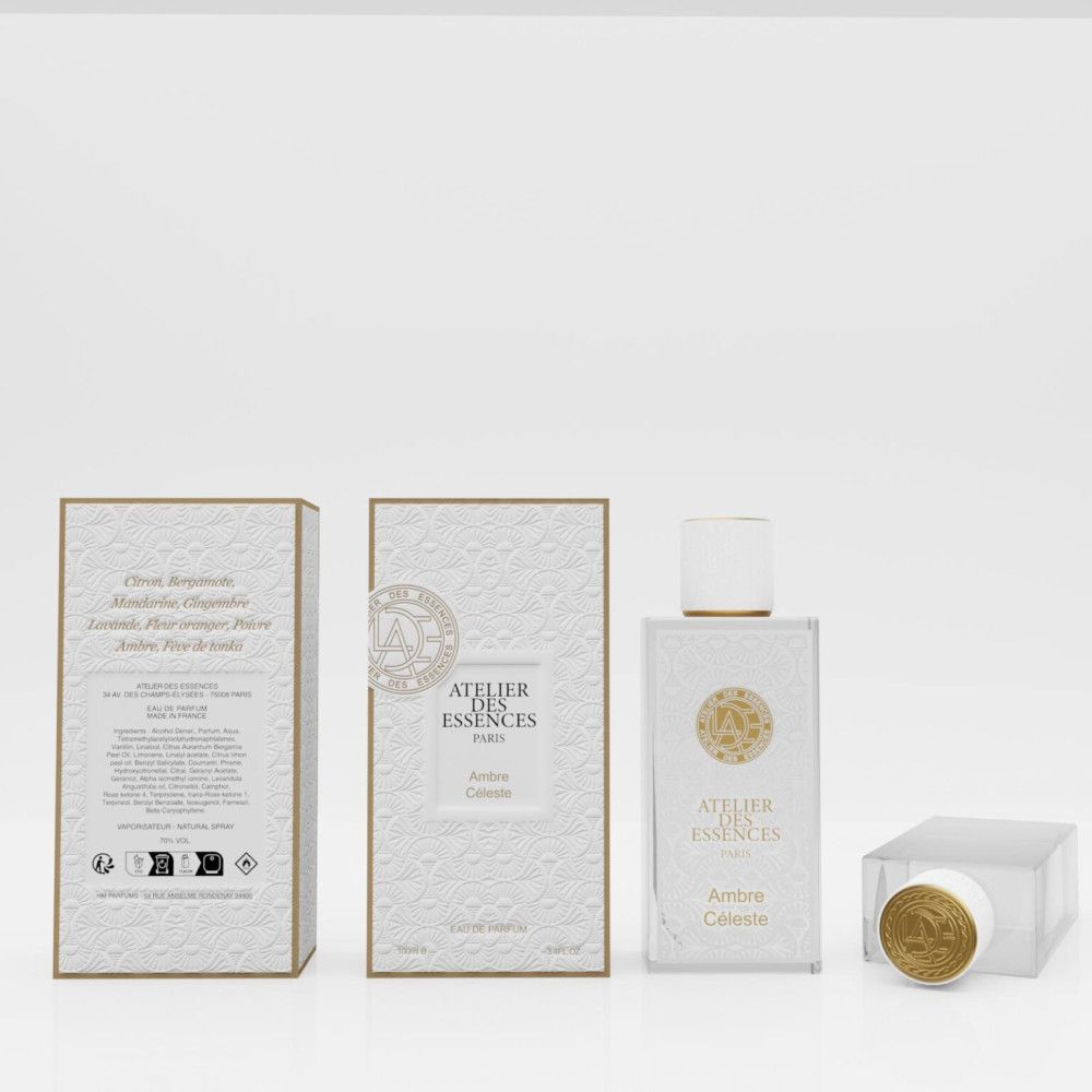 Parfumfles en verpakking. Witte rechthoek met gouden details. Opschrift: Atelier des Essences, Ambre Céleste. Doos met tekst.