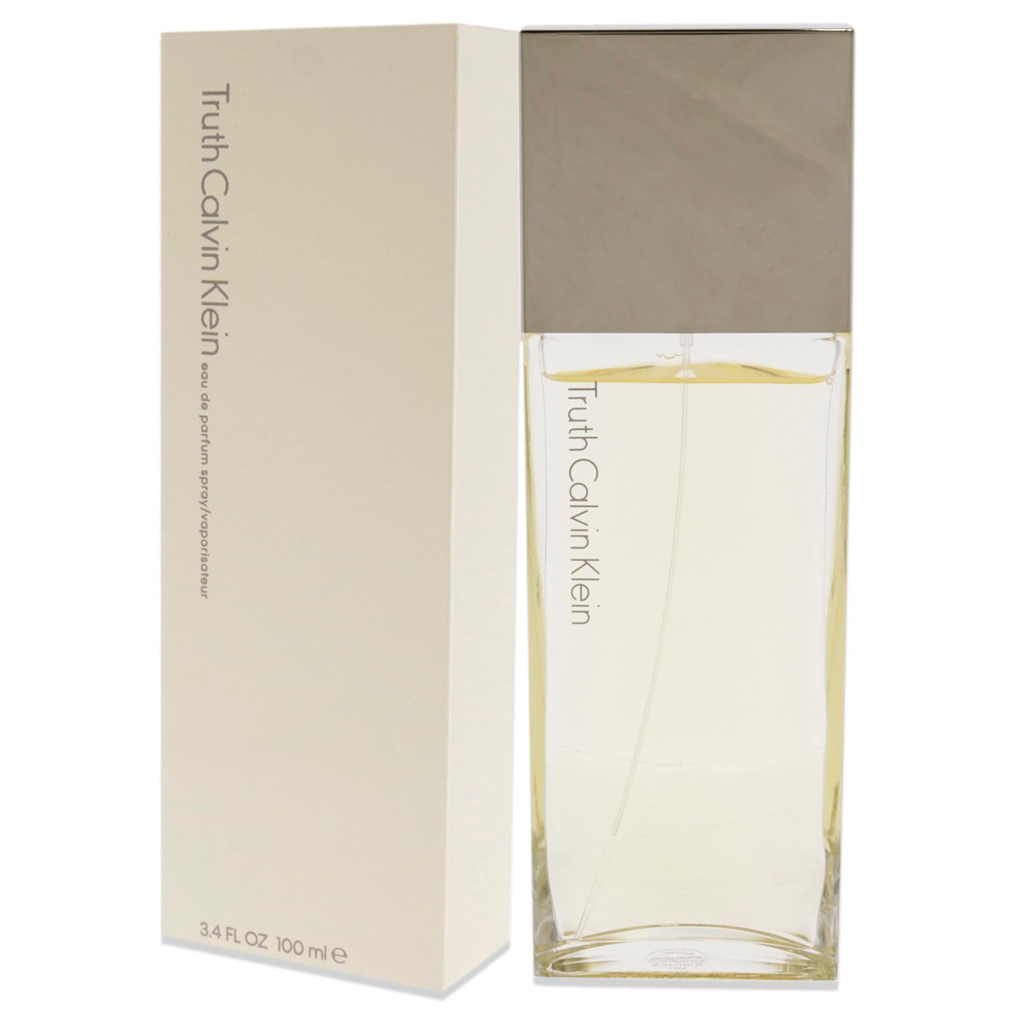 Parfumfles en verpakking. Fles rechthoekig, transparant met zilveren dop. Verpakking beige.