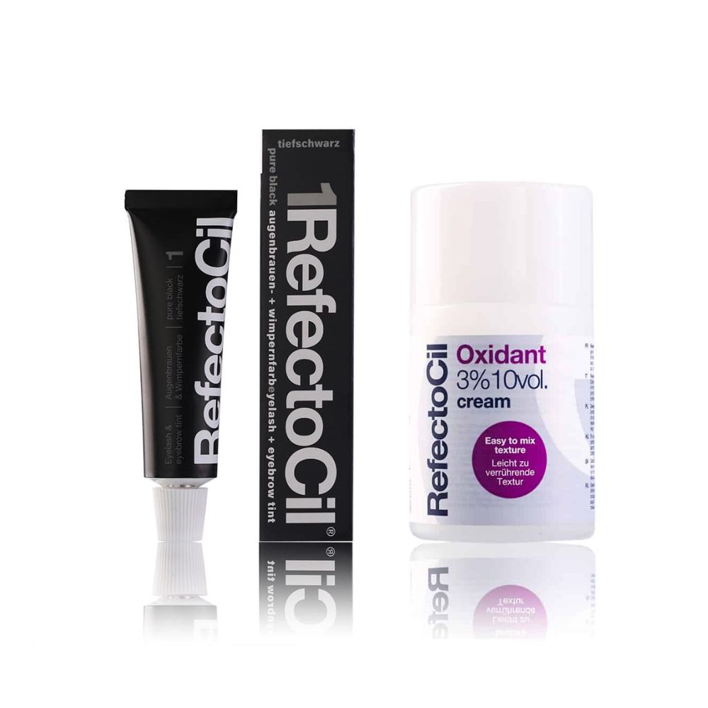 Set van zwarte wimper- en wenkbrauwverf en oxidantcrème. Zwarte tube, zwarte doos en witte fles met paarse accenten.