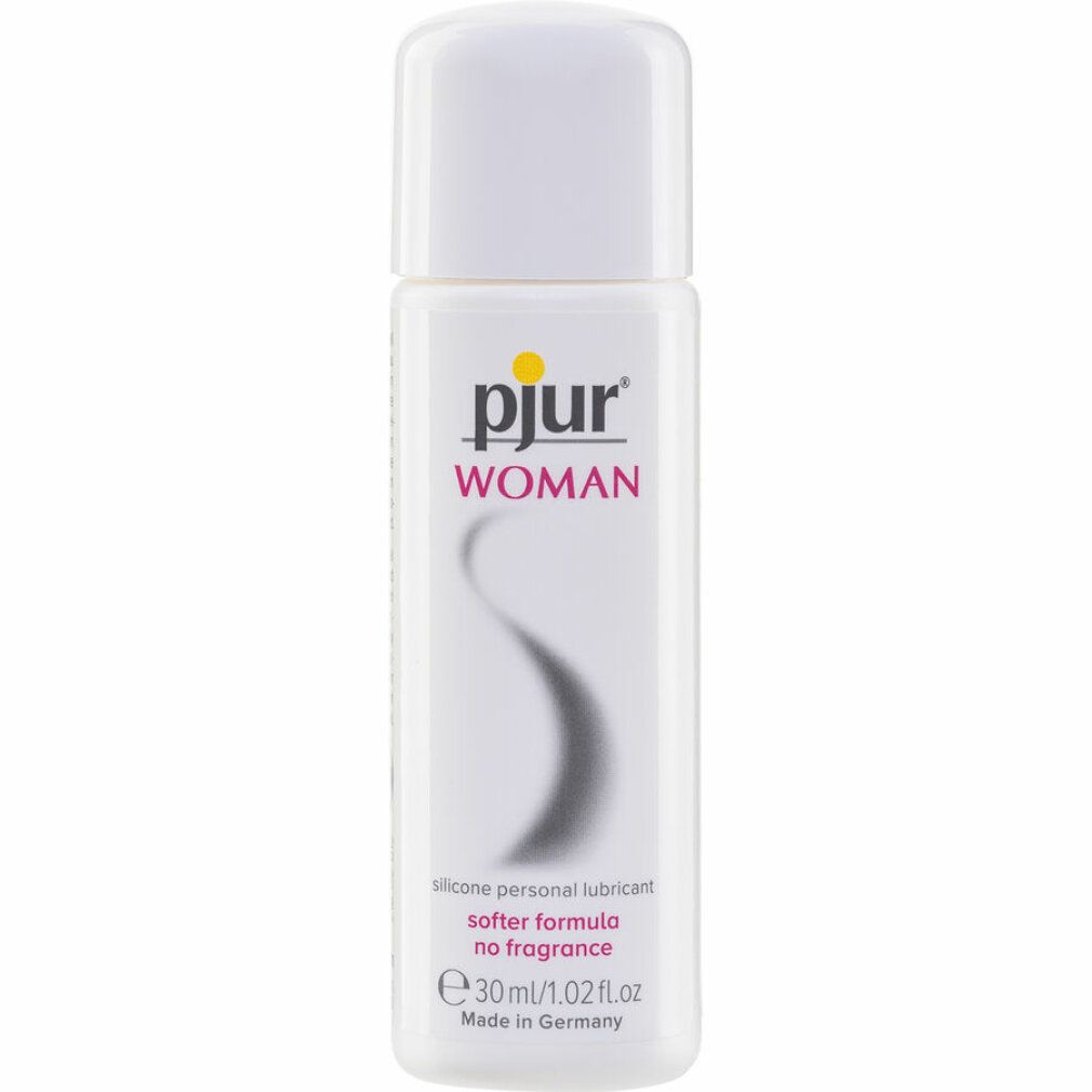 pjur WOMAN, lubrifiant silicone. Flacon blanc, logo jaune. Ligne noire incurvée. Texte: softer formula no fragrance, 30 ml/1.02 fl oz.