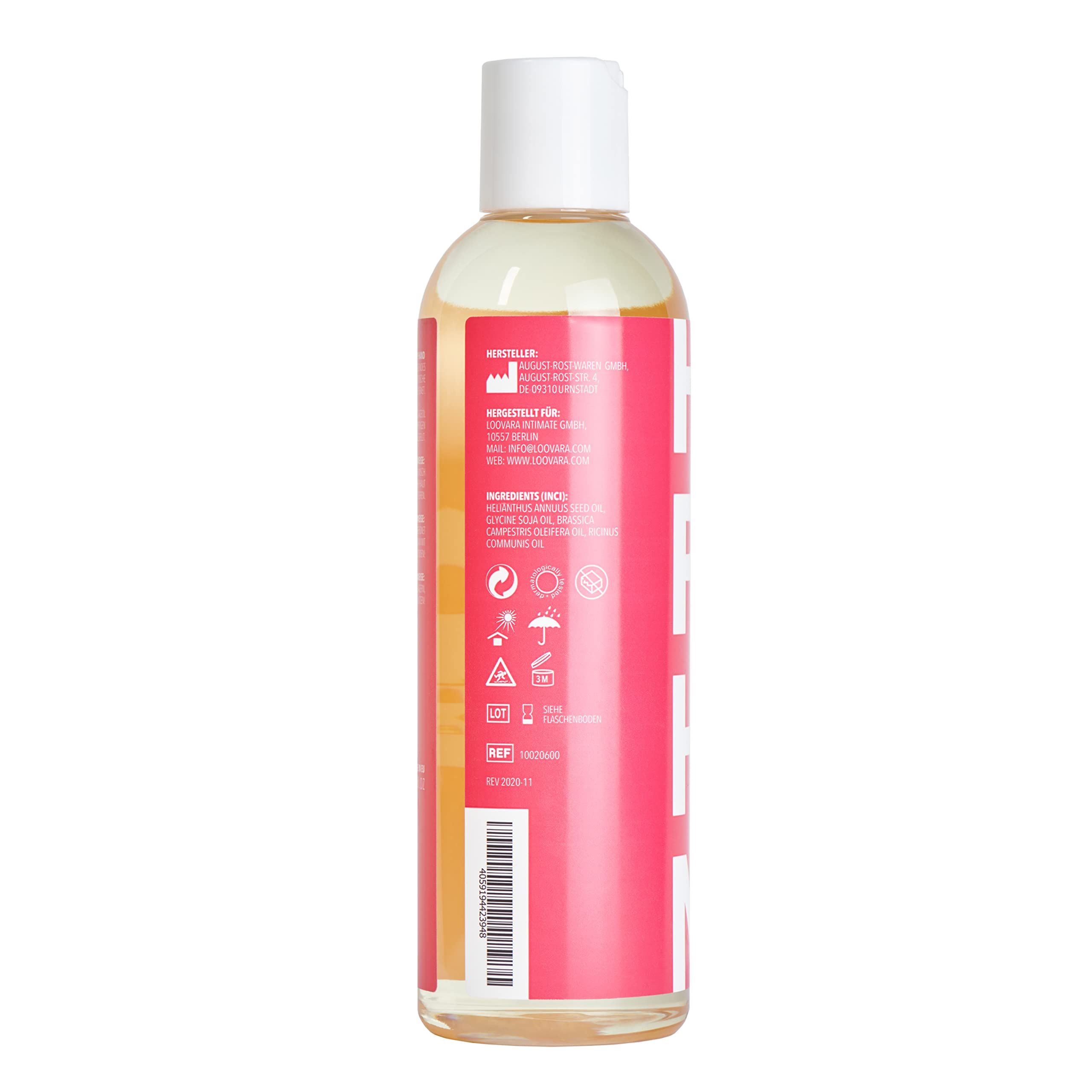 Fles Loovara Happy Hand massageolie met rood label en witte letters, omringd door oliespatten.