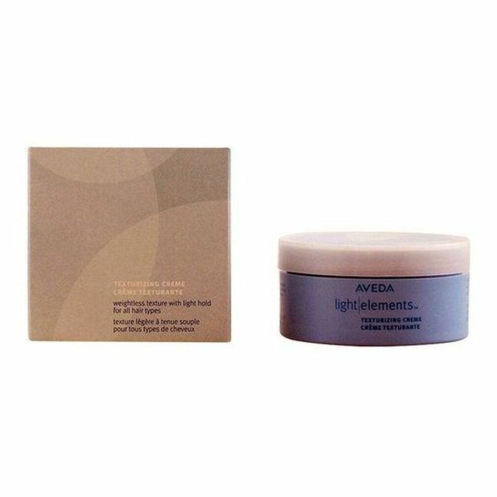 Emballage marron et pot. Inscription: Aveda light elements. Crème texturisante. Texture légère pour tous types de cheveux.