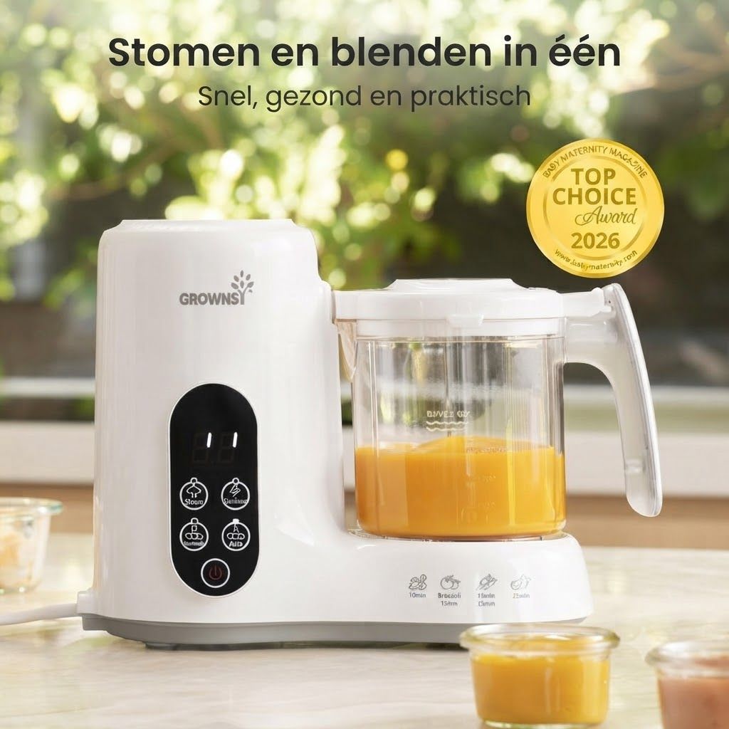 Witte babyvoedingmaker met transparante kan gevuld met oranje babyvoeding. Bedieningsknoppen zijn zichtbaar.