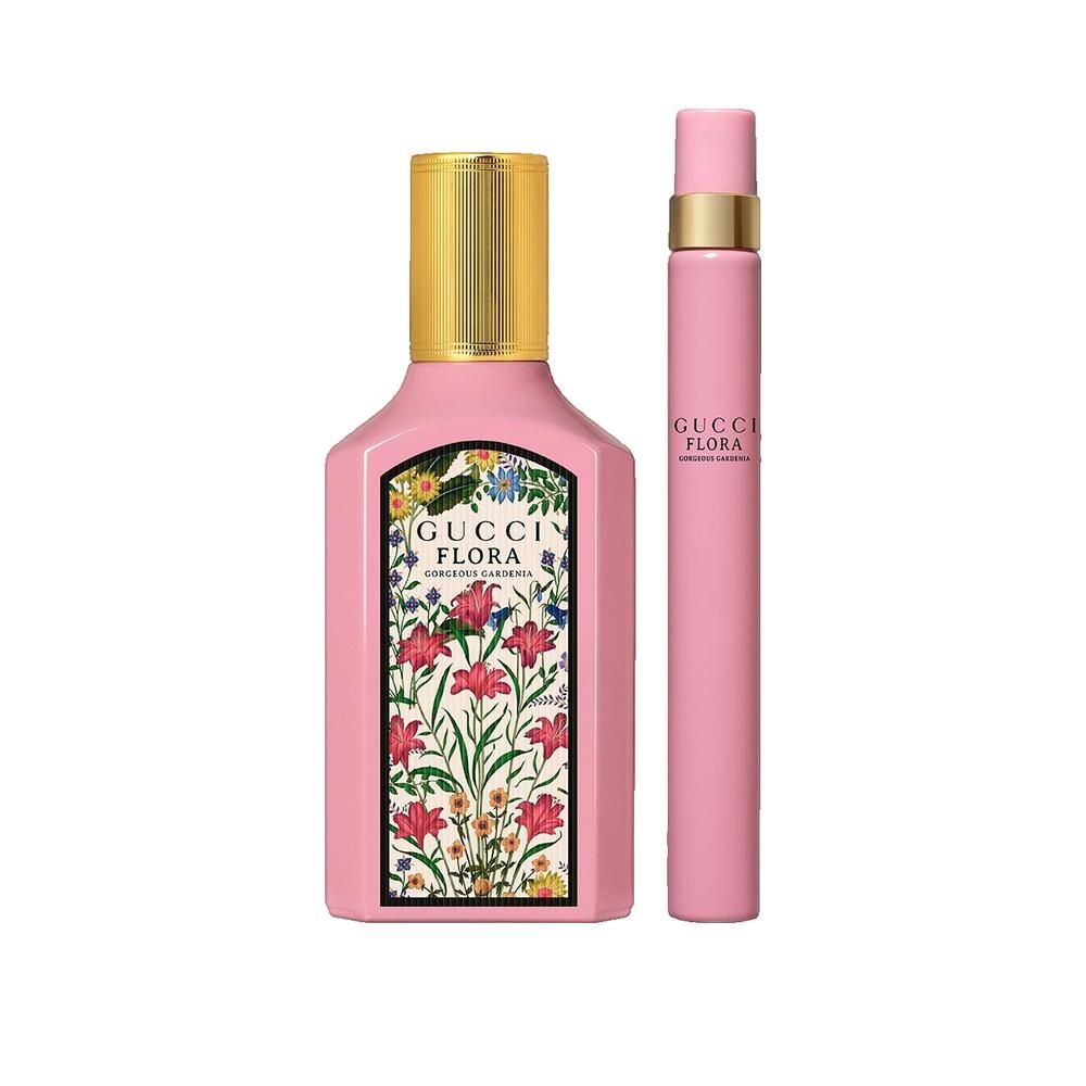 Roze fles met gouden dop en bloemenlabel. Daarnaast een roze verstuiver met gouden tekst.