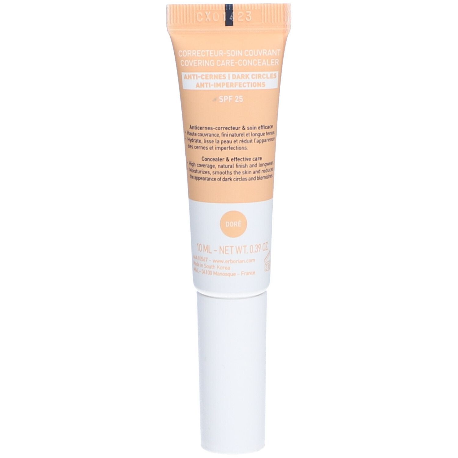 Dos du tube de correcteur. Texte: CORRECTEUR SOIN COUVRANT, ANTI-CERNES, SPF 25. Teinte: DORE. Volume: 10 ml.