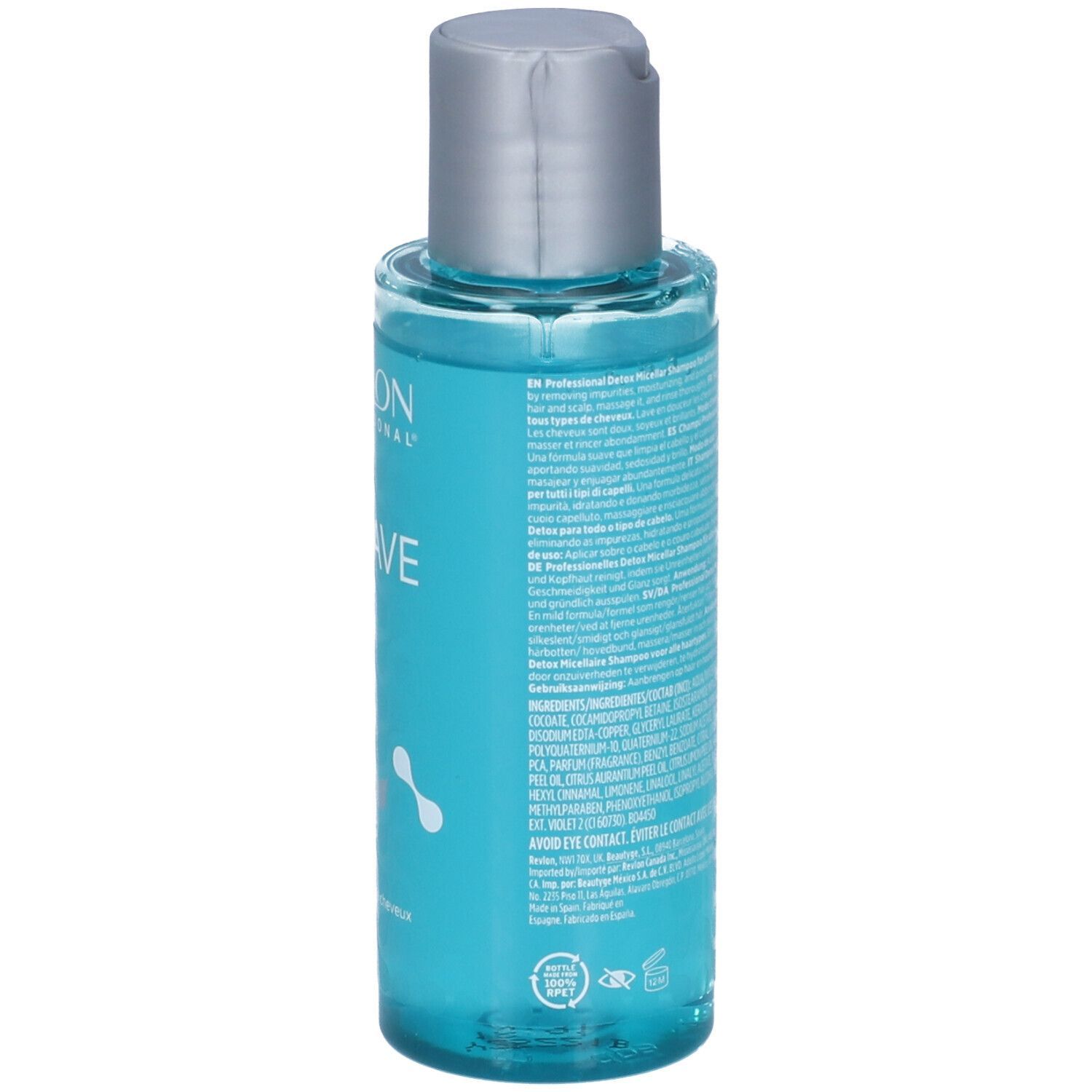 Achterkant van een transparante fles met blauwe shampoo. Zilveren dop. Etiket met tekst.