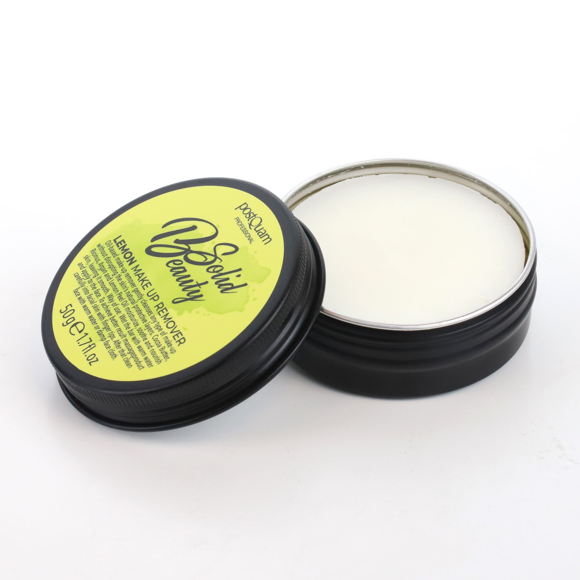 Zwarte, ronde pot met deksel. Op deksel staat "Lemon Make Up Remover". Pot is open en toont een vaste reiniger.