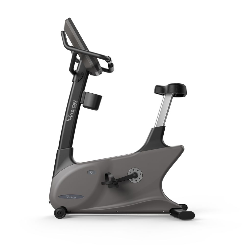 Grijze hometrainer met Vision-logo. Ergonomisch zadel, stuur, pedalen en console. Bekerhouder.