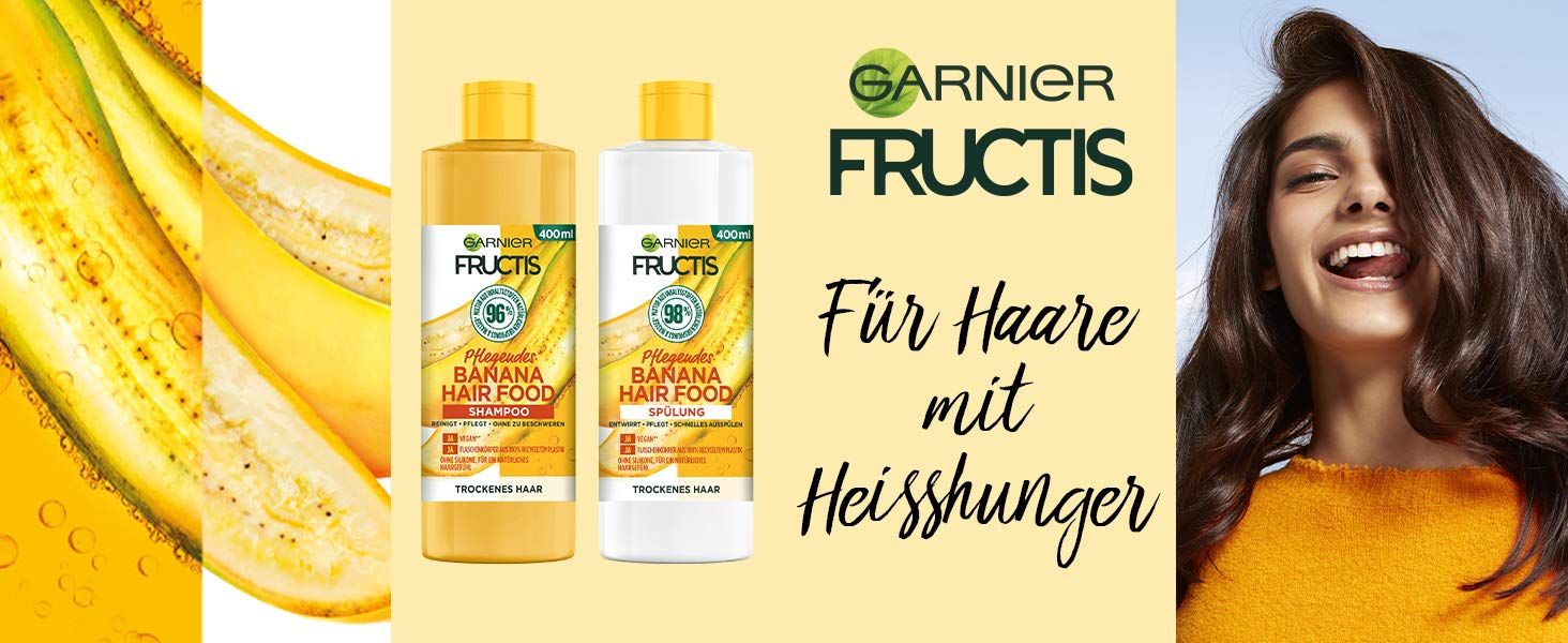 Reclamebeeld met Garnier Fructis shampoo flessen en een vrouw met glanzend haar. Tekst: Voor haar met vreetbuien.