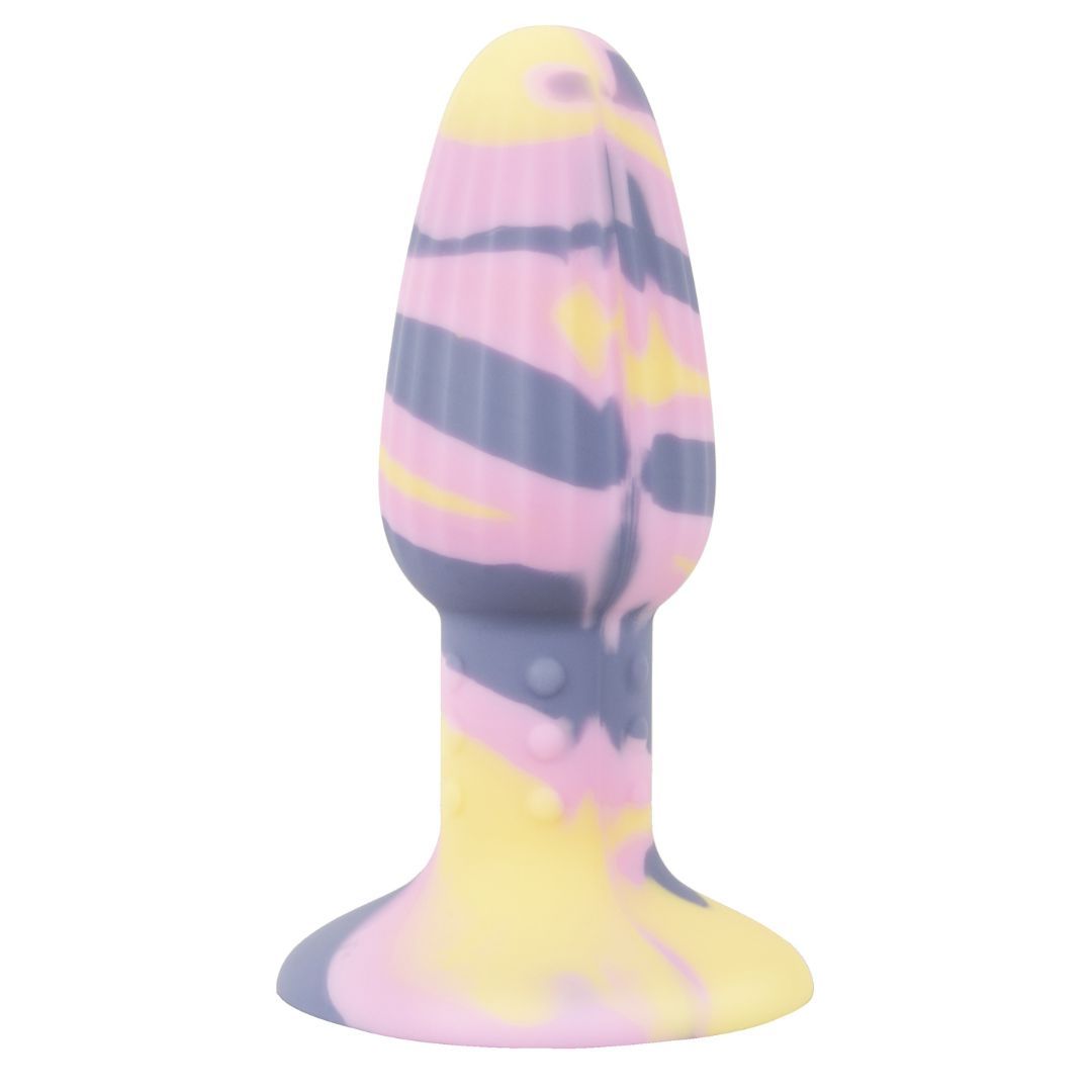 Plug anal avec ventouse. Design multicolore jaune, rose et violet. Surface cannelée. Base avec ventouse.