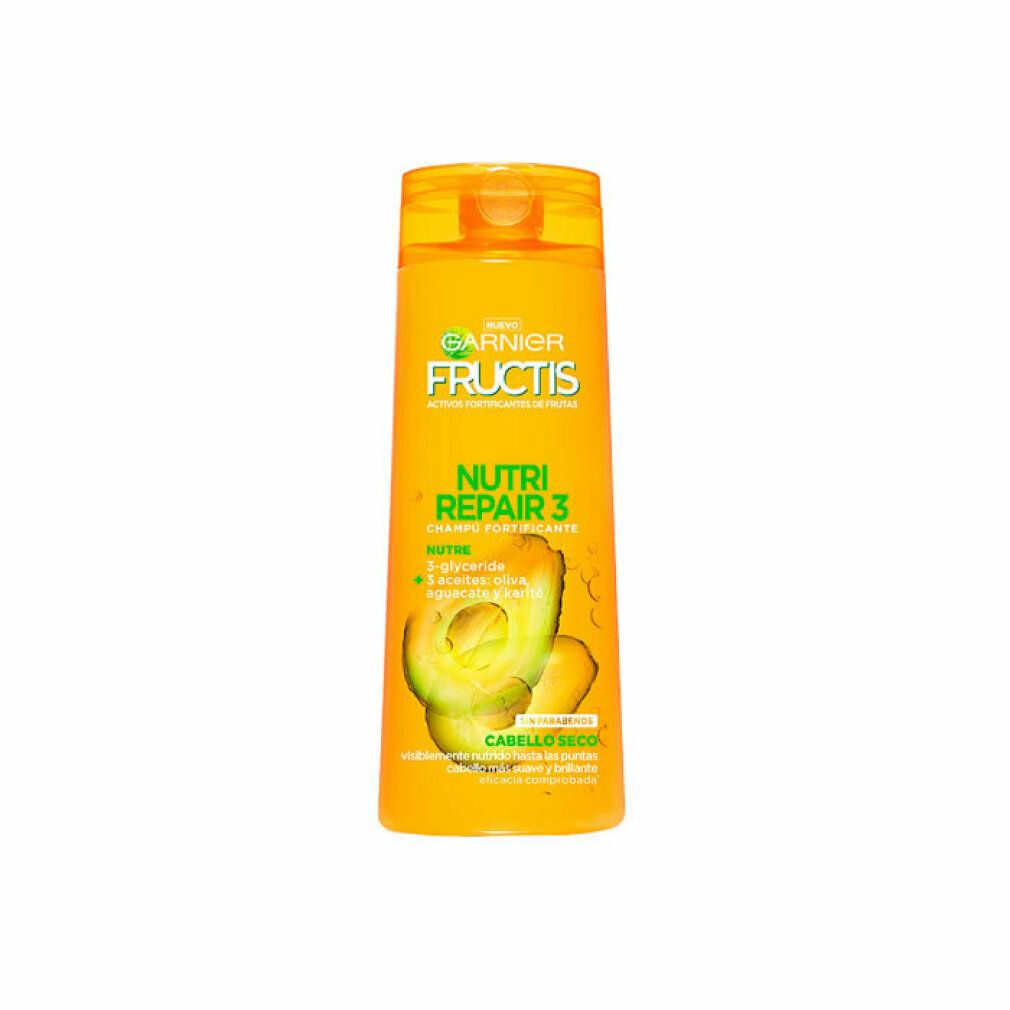 Flacon de shampooing jaune avec logo Garnier Fructis et texte. Illustration d'avocat. Inscription : Nutri Repair 3, Cabello Seco.