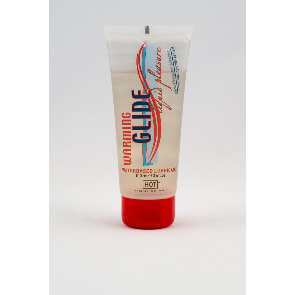 Tube transparent avec bouchon rouge. Étiquette : WARMING GLIDE, waterbased lubricant, 100ml.