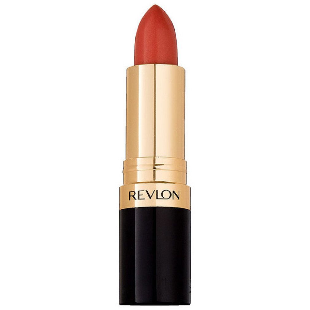 Rouge à lèvres Revlon, couleur corail. Corps doré, base noire. REVLON est écrit sur le corps.