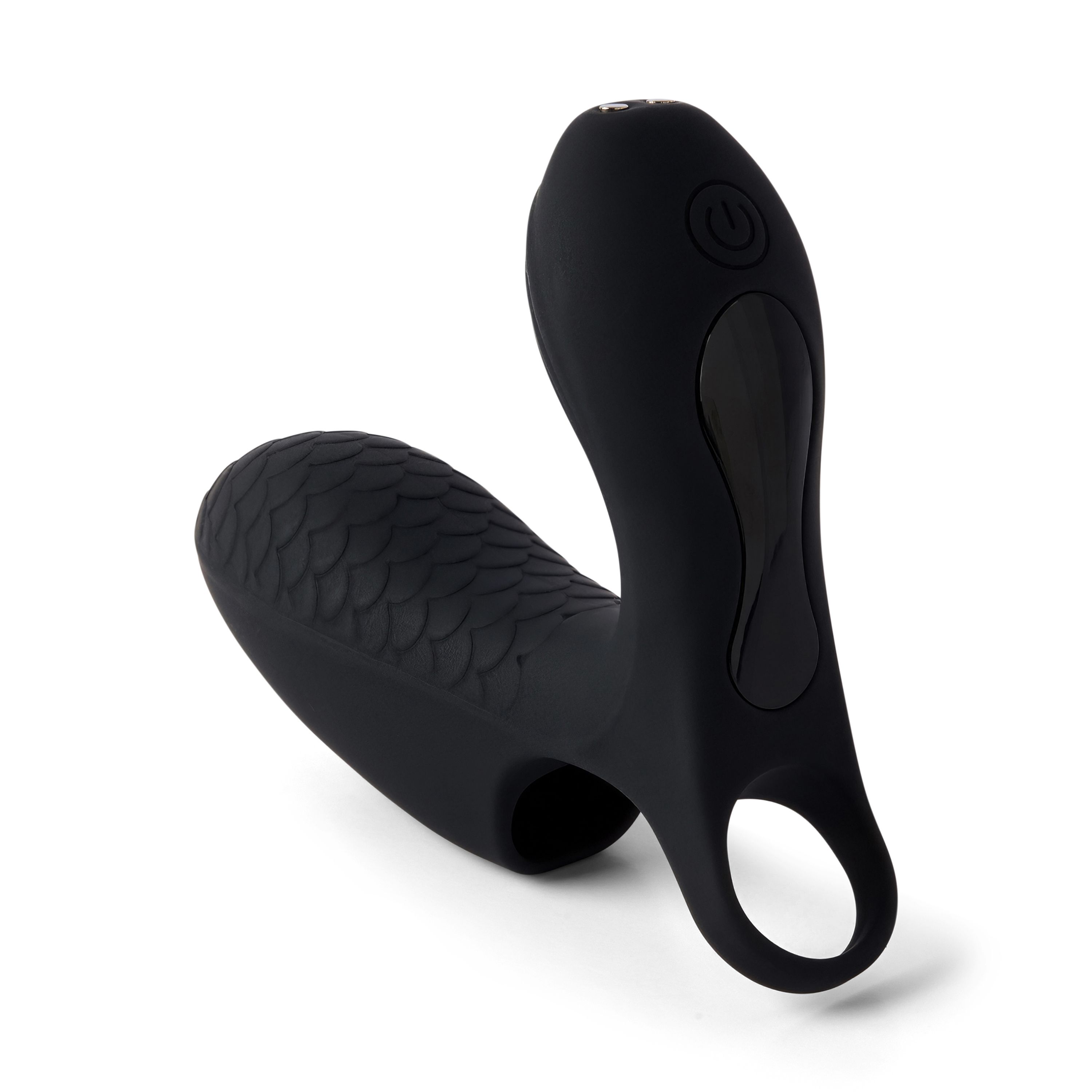 Produit de bien-être noir avec surface texturée et anneau. Avec bouton marche/arrêt. Sur fond blanc.