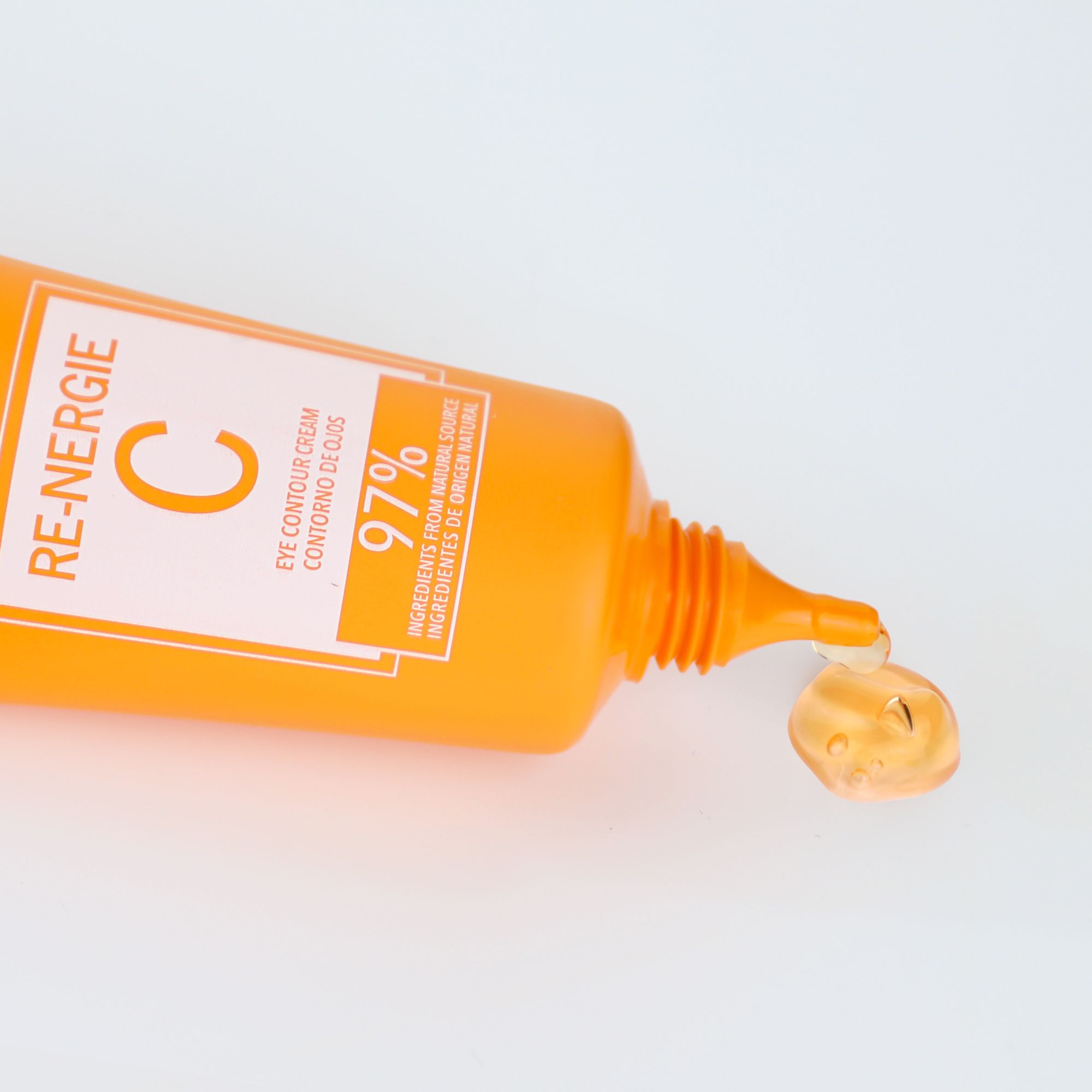 Postquam Re-Nergie C crème contour des yeux. Tube orange, produit qui coule. Texte: Eye Contour Cream, 97% ingrédients naturels.