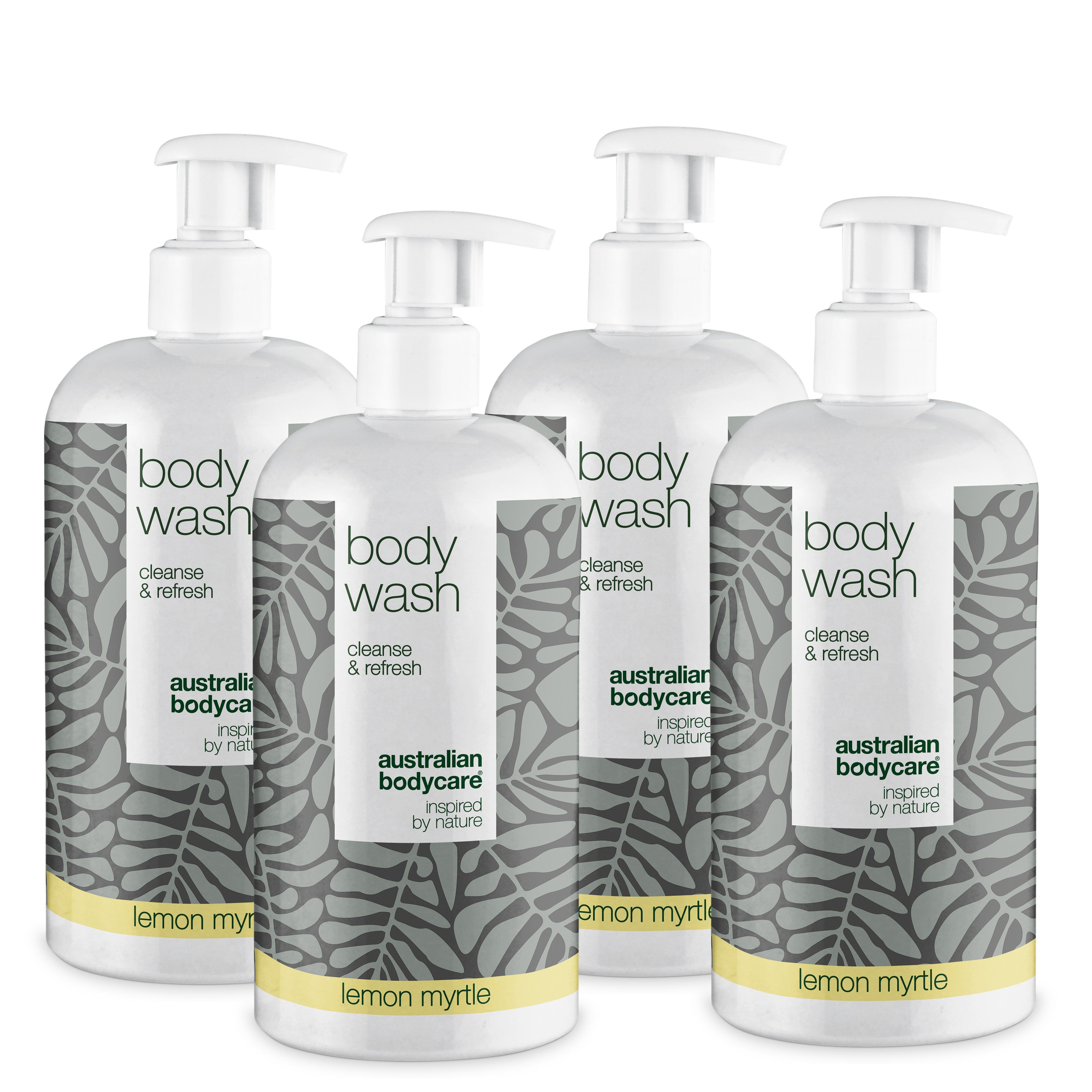 Vier flessen Body Wash met pomp. Wit etiket met bladeren en tekst. Geel: Lemon Myrtle.