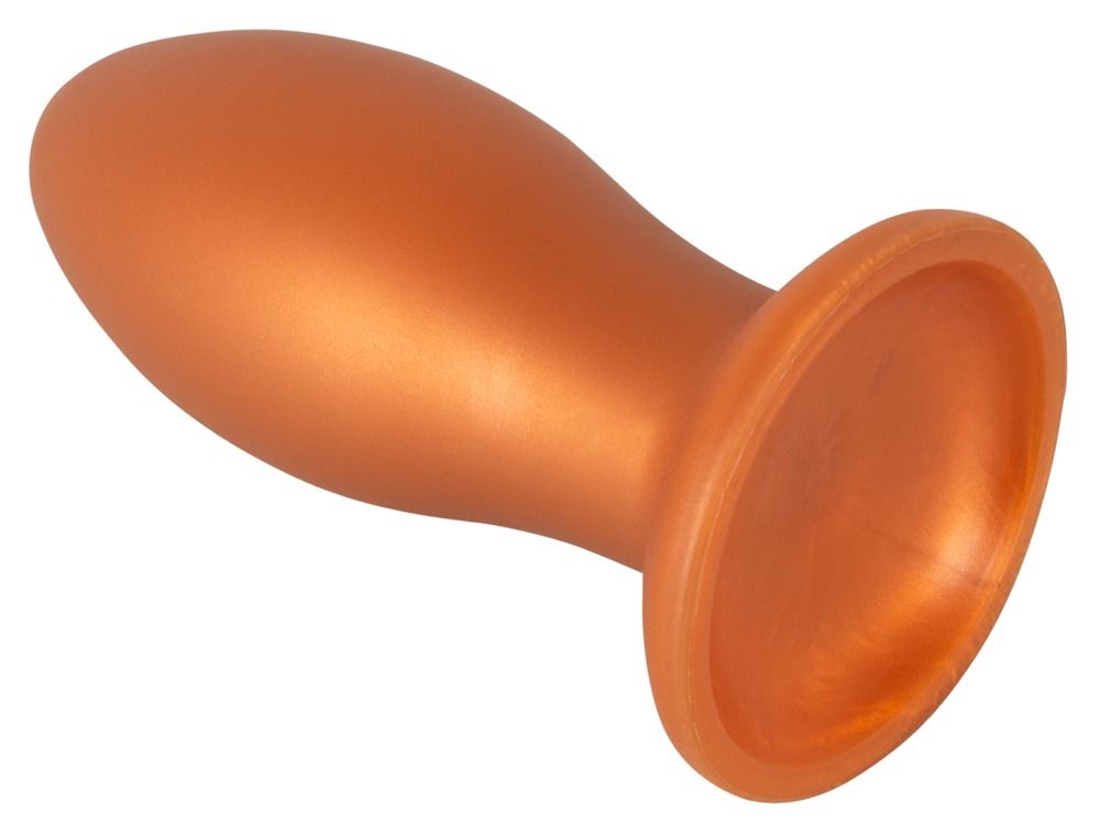Plug anal orange avec ventouse, vu de côté.