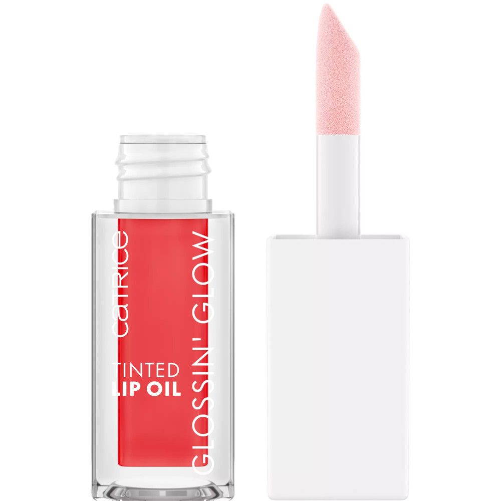 Getinte lipolie in glazen fles met applicator. Rode inhoud, witte dop. Opschrift: Catrice, Glossin' Glow, Tinted Lip Oil.