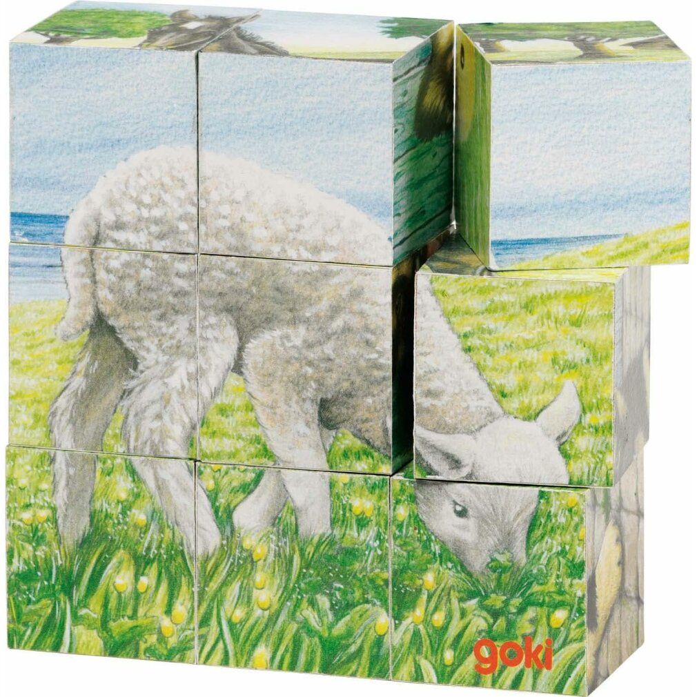 Puzzle en cubes avec illustration d'un agneau dans un pré. Logo Goki en bas à droite. Neuf cubes forment l'image.