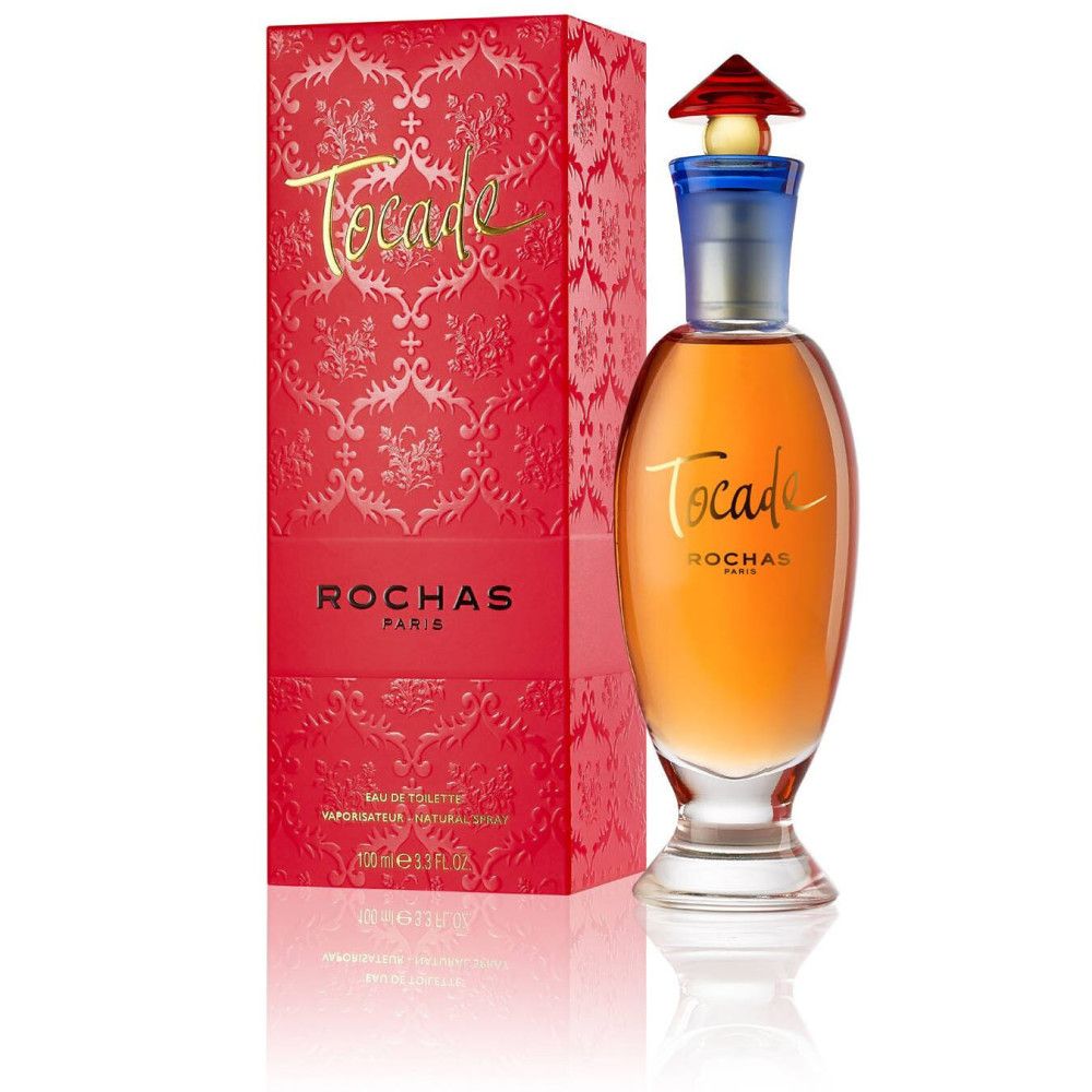 Flacon Rochas Tocade Eau de Toilette et boîte rouge avec motif et texte.