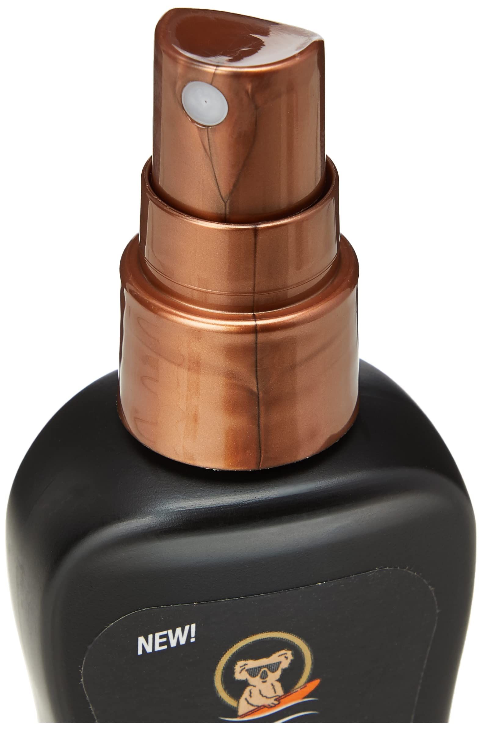 Gros plan sur le pulvérisateur d'un flacon de spray solaire noir. Pulvérisateur marron avec bouton de pulvérisation blanc.