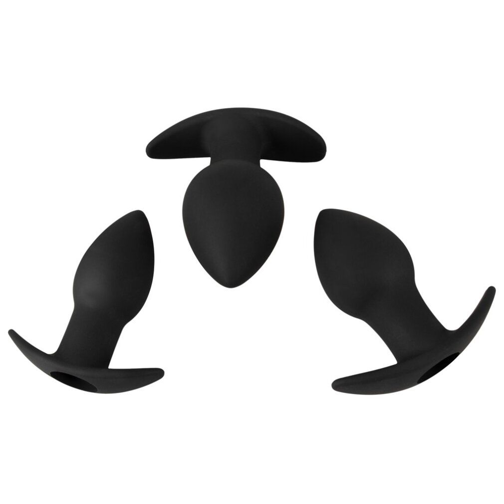 Trois plugs anaux noirs en silicone disposés en triangle, vus de dessus.