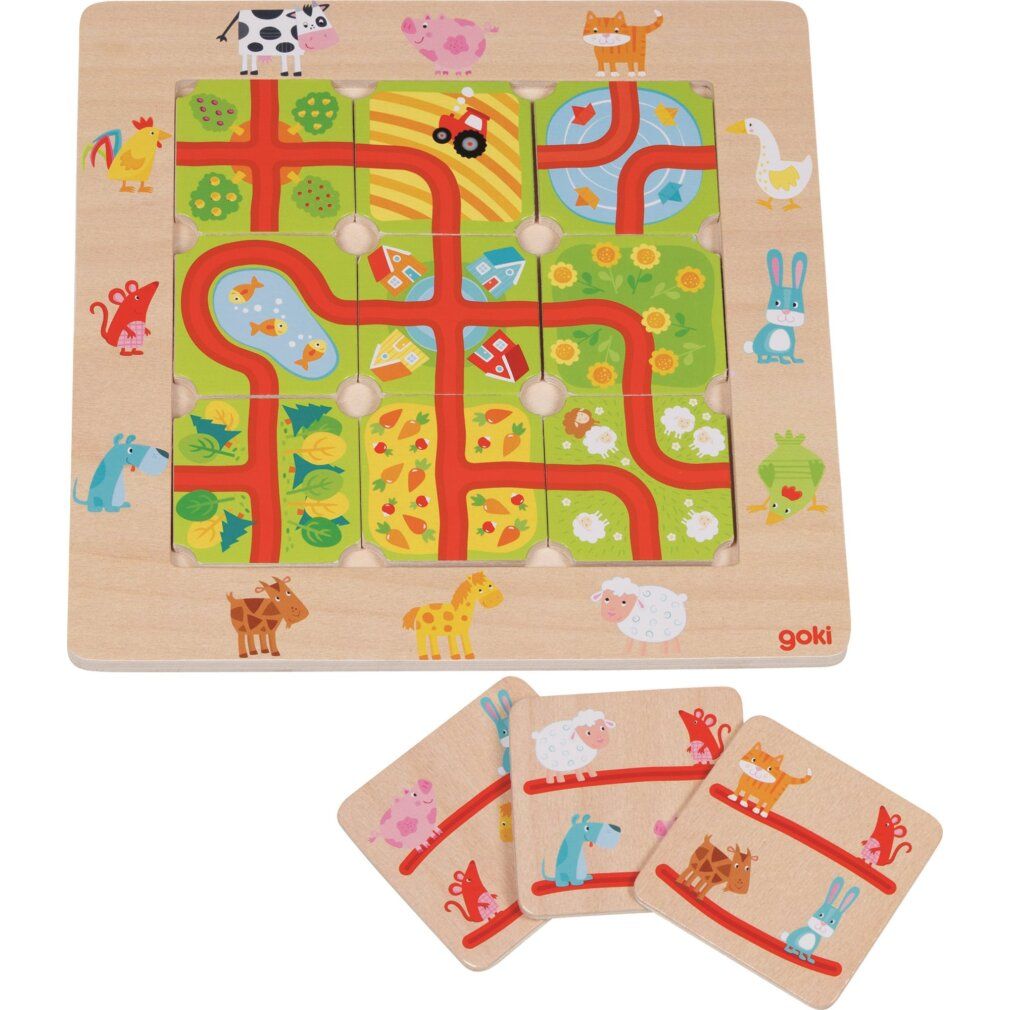 Houten puzzel met dieren en wegen. Het bord is vierkant met puzzelstukjes. Goki-logo rechtsonder.