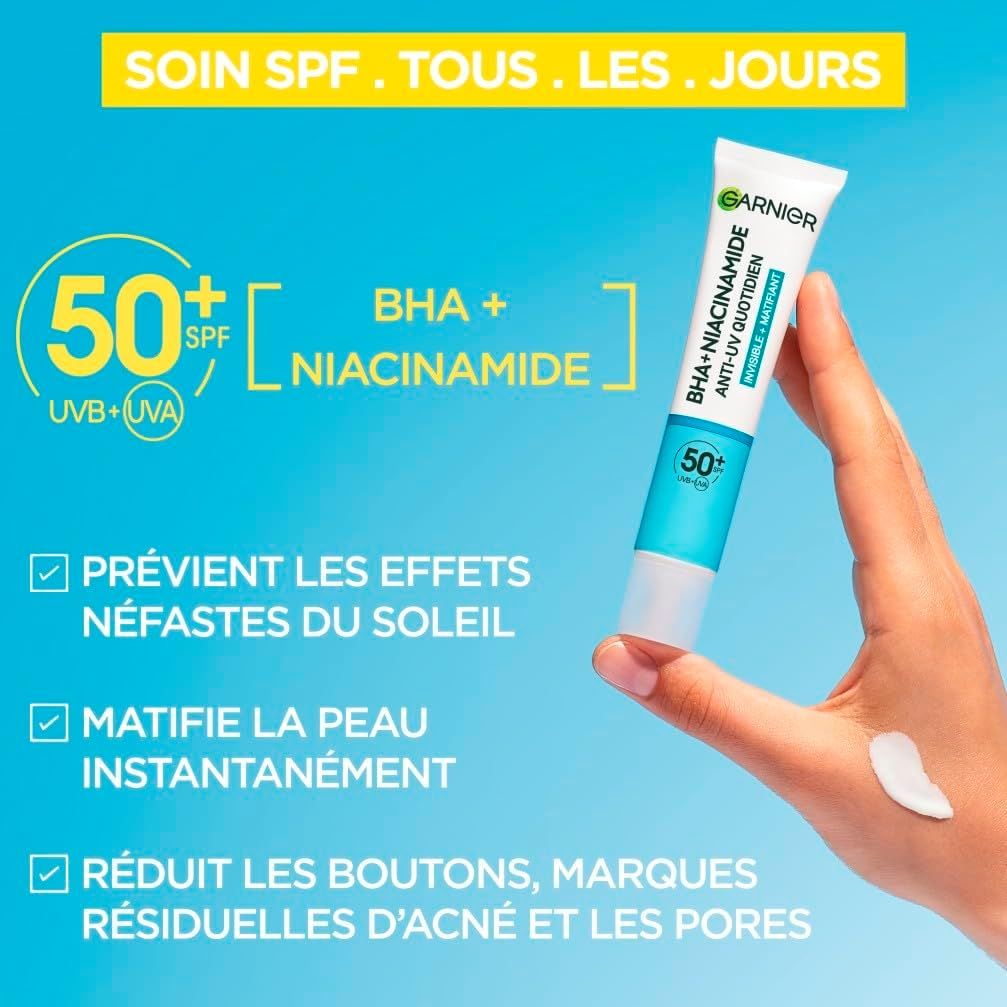 Tube de crème solaire Garnier SPF 50+, BHA et Niacinamide. Protection UV.