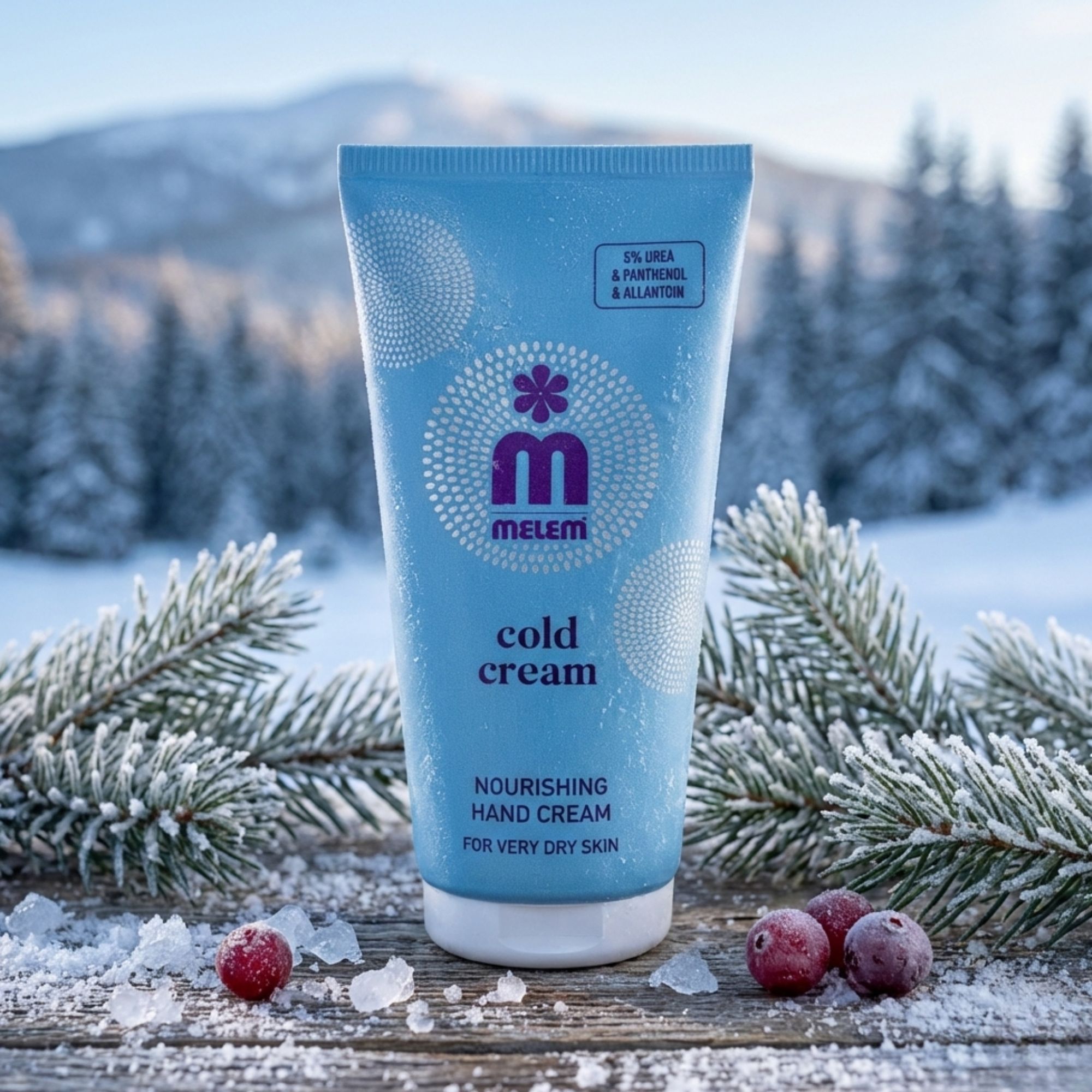 Tube bleu clair "Melem Cold Cream". Inscription: "Nourishing Hand Cream for very dry skin". Fond: paysage enneigé.