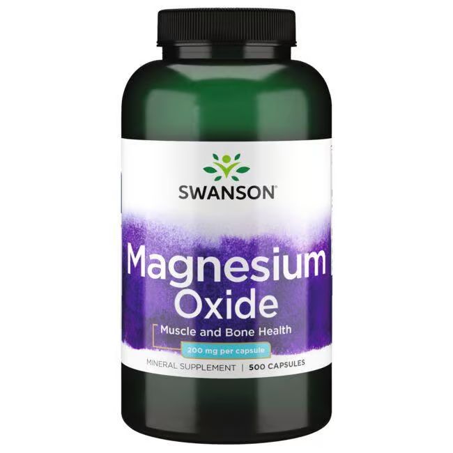 Flacon vert avec bouchon noir. Étiquette avec "SWANSON", "Magnesium Oxide", "200 mg par capsule" et "500 Capsules".