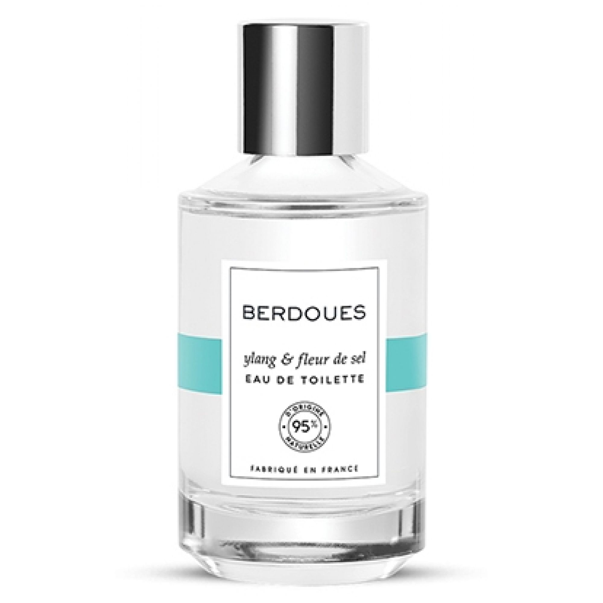 Flacon en verre avec bouchon argenté, étiquette "BERDOUES ylang & fleur de sel EAU DE TOILETTE" et "95% d'origine naturelle".