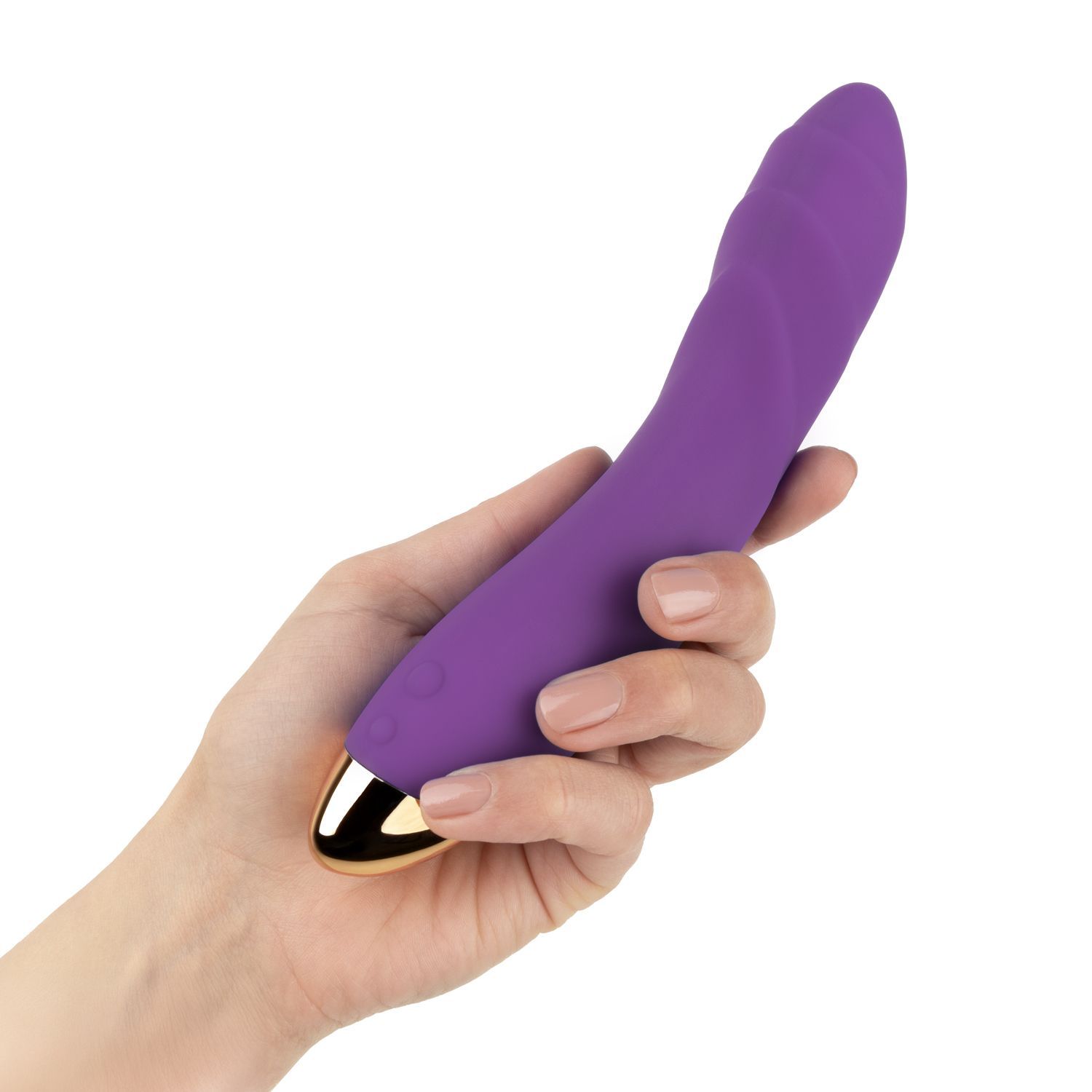 Vibrateur violet avec embout doré, tenu dans une main.