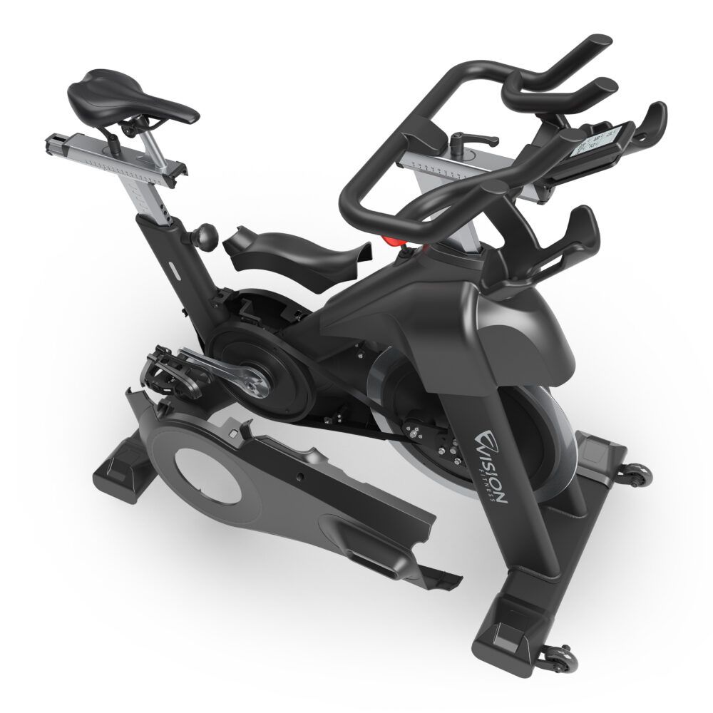 Indoorfiets met verwijderde afdekkingen. Zichtbaar: vliegwiel, pedalen, frame en Vision-logo.